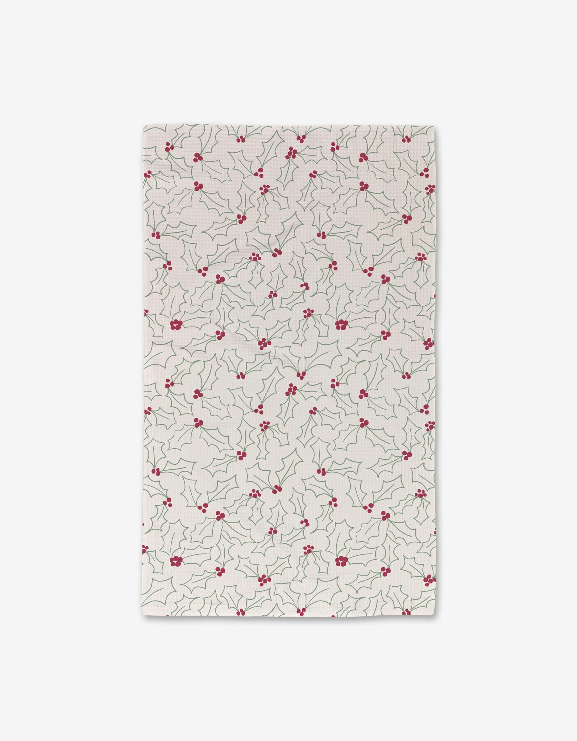 The Merry Holly Luxe Hand Towel by Kayla Ann features a white rectangular design with green holly leaves and red berries, crafted with Geoweave technology for ultra-absorbency and festive holiday style.
