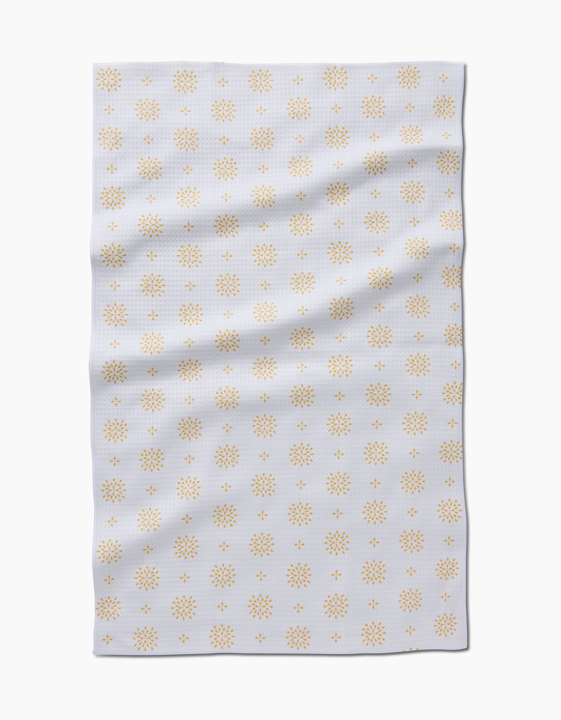 The Morning Petals Luxe Hand Towel by Danelys Sidron features a white rectangular Geoweave cloth, slightly wrinkled, with a repeating pattern of small yellow starburst-like designs for an ultra-absorbent, stylish touch.
