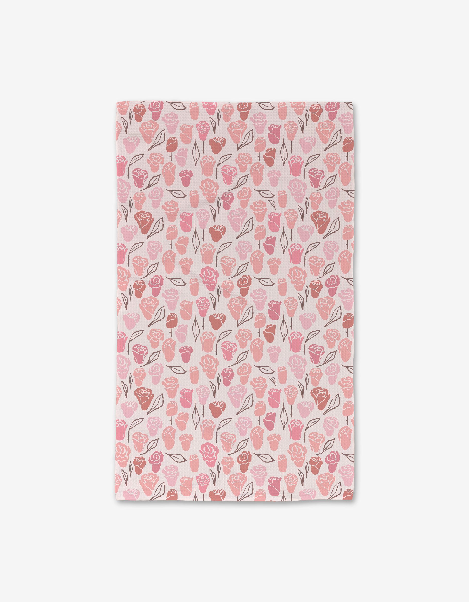 The Neutral Rose tea towel by Elisabeth Wing is a rectangular pink and white towel with a floral pattern. Crafted from recycled materials, it’s ultra-absorbent—blending sustainability with beauty. Shown laid flat on a white background.