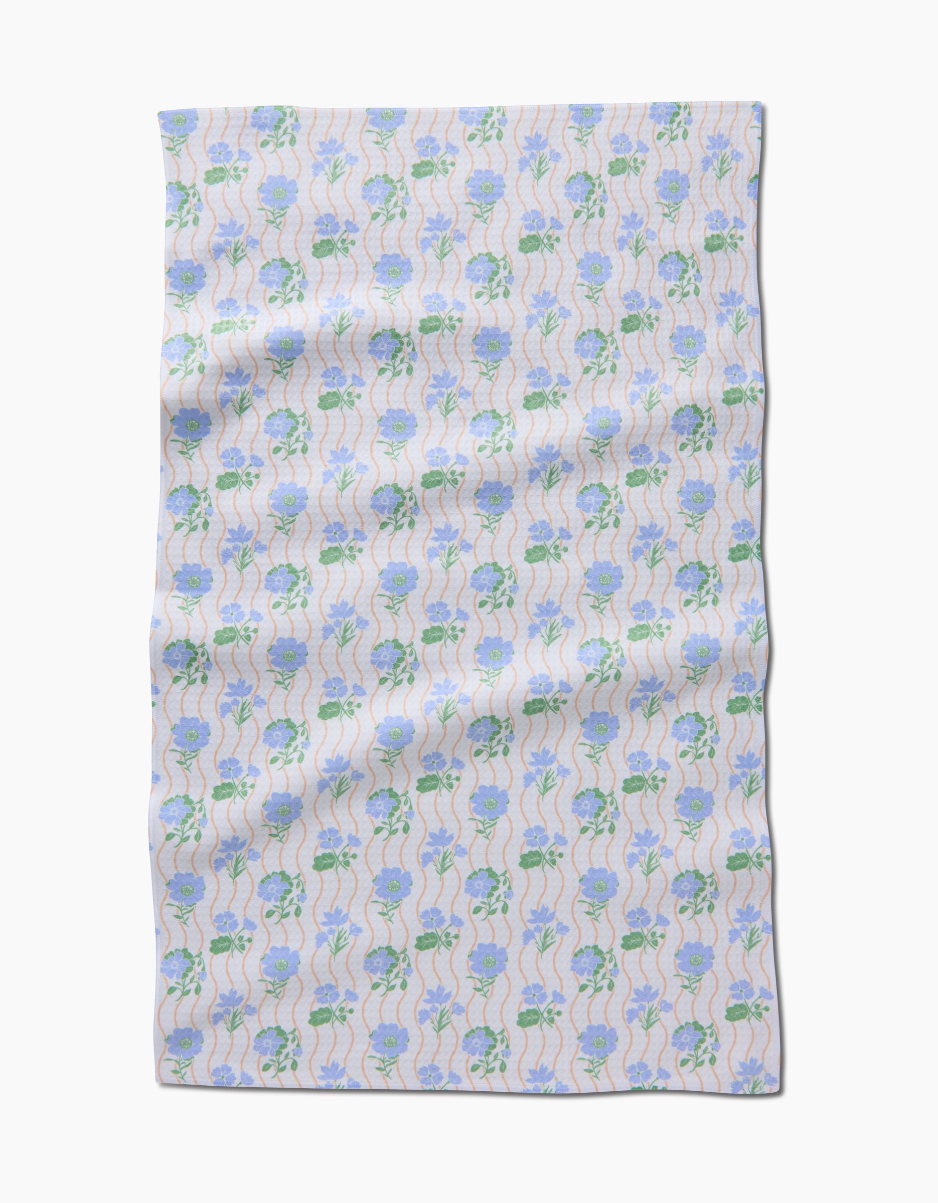 The Spring Wave by Danelys Sidron is a rectangular cloth showcasing light blue flowers with green stems on white, displayed flat with gentle wrinkles. Crafted with ultra-absorbent, quick-drying Geoweave technology.