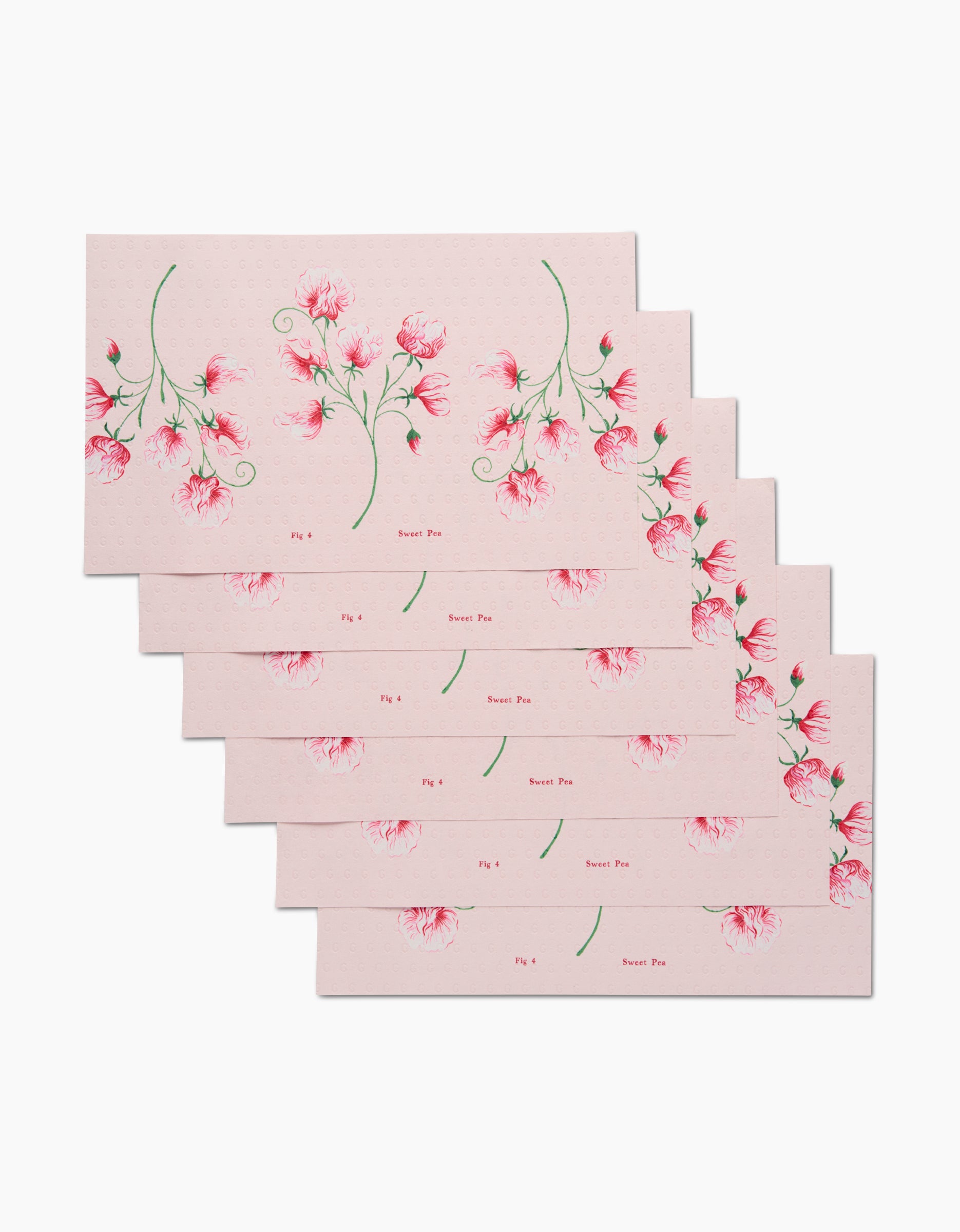 Six eco-friendly Linda Fox April Sweet Pea envelopes, each featuring delicate pink sweet pea flower illustrations and Sweet Pea printed on the front, are arranged in a staggered stack on a white background.