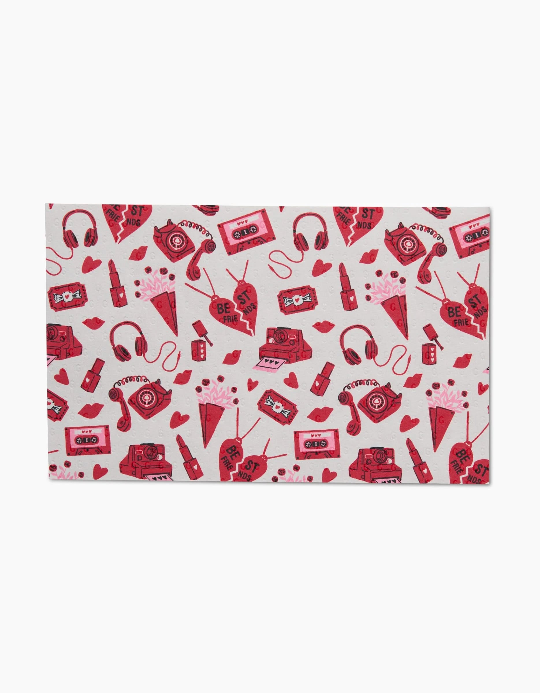 The Best Friends paper towels by Charlie Rowan Designs feature a playful pattern of hearts, lipsticks, headphones, cameras, pizza slices, game controllers, and cassettes on a light background—an eco-friendly choice.