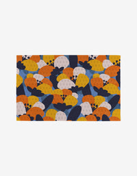 Bold Petal Bloom by Claire Iglesias is a rectangular, eco-friendly mat featuring an overlapping strawberry pattern in yellow, orange, navy blue, and light pink on white—a stylish reusable alternative to paper towels.