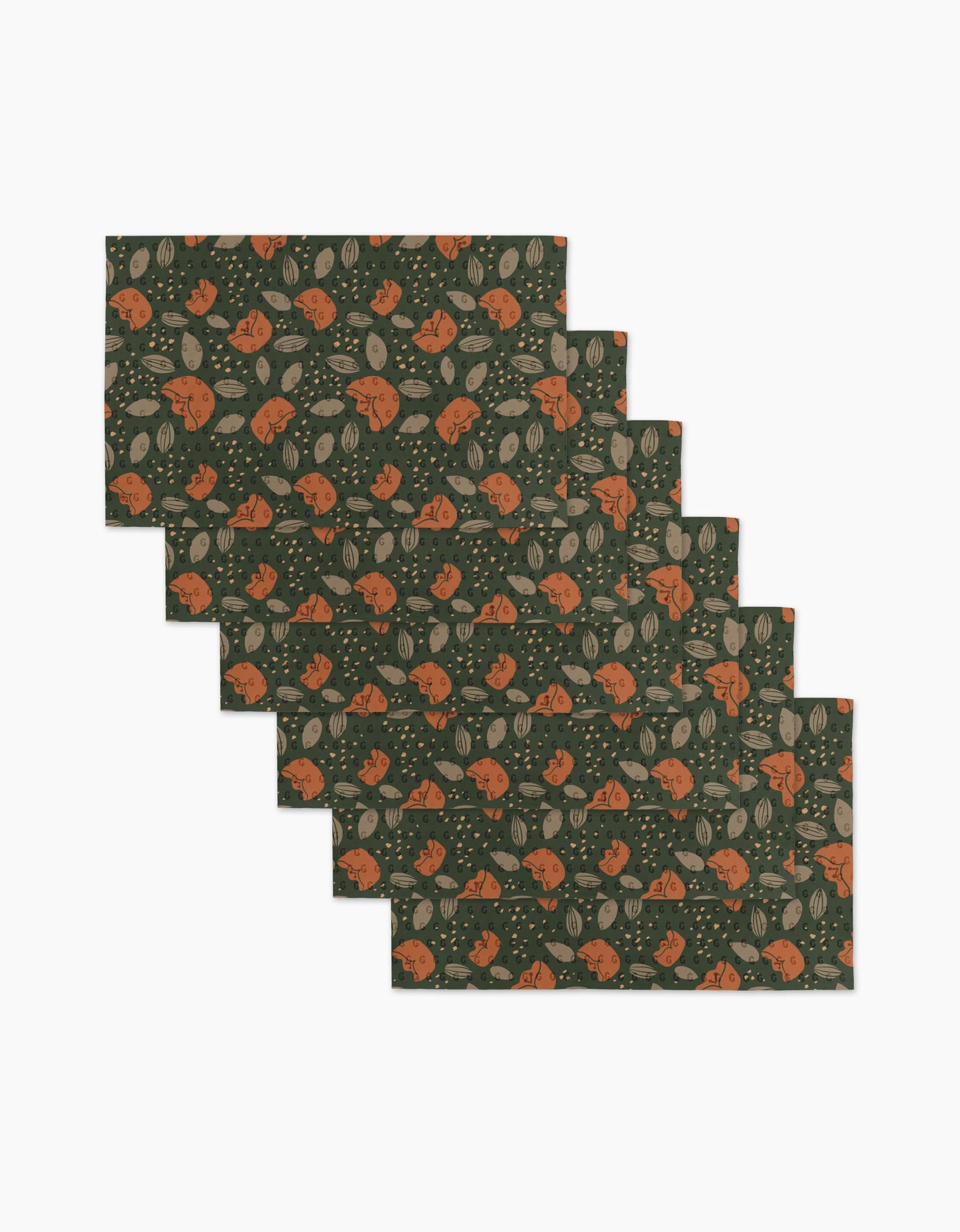 Six Cali Sun reusable paper towels by Amberleigh Adoff, featuring a dark green background with orange foxes, gray leaves, and beige accents, are shown arranged in a staggered stack.