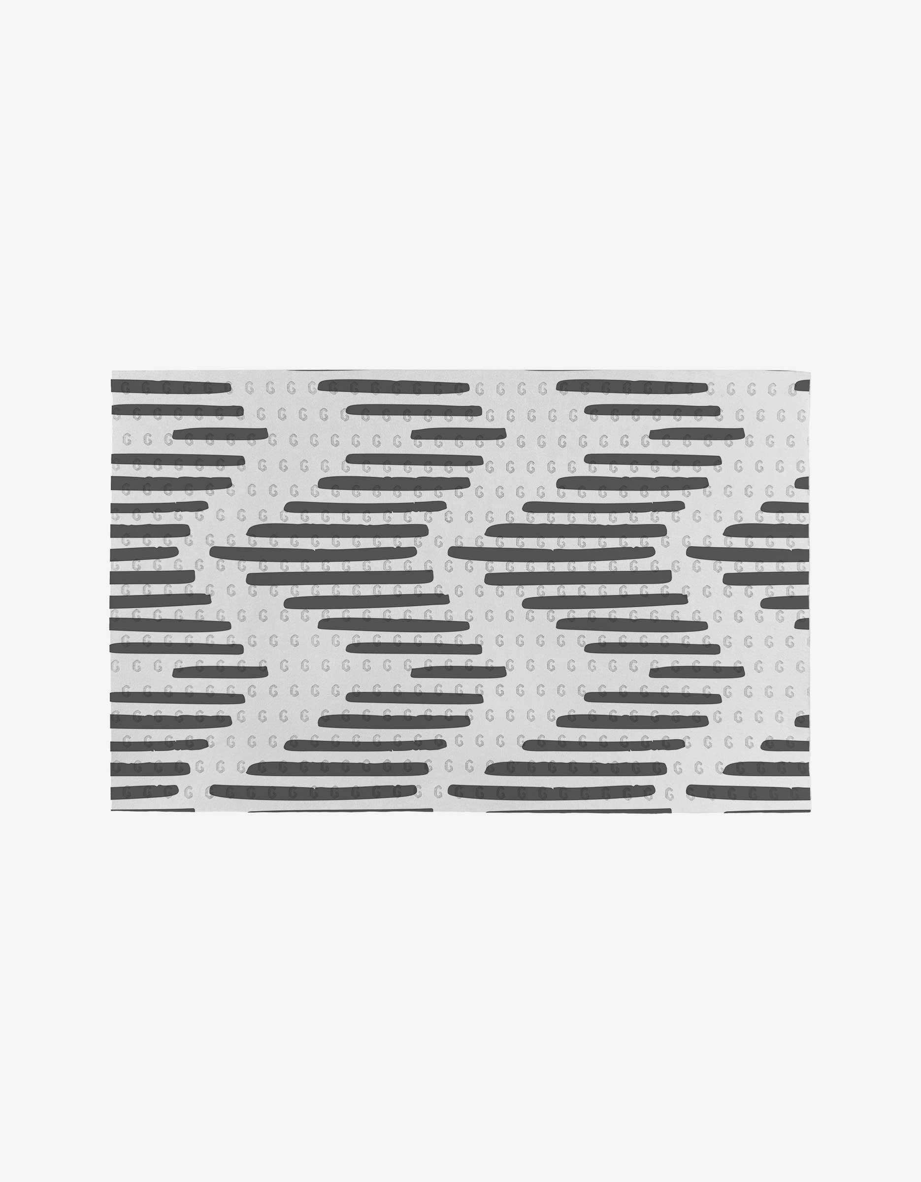 Charlie by GEOMETRY is a white rectangular surface with small gray circles and black horizontal lines, made from post-consumer recycled materials as an eco-friendly alternative to paper towels.