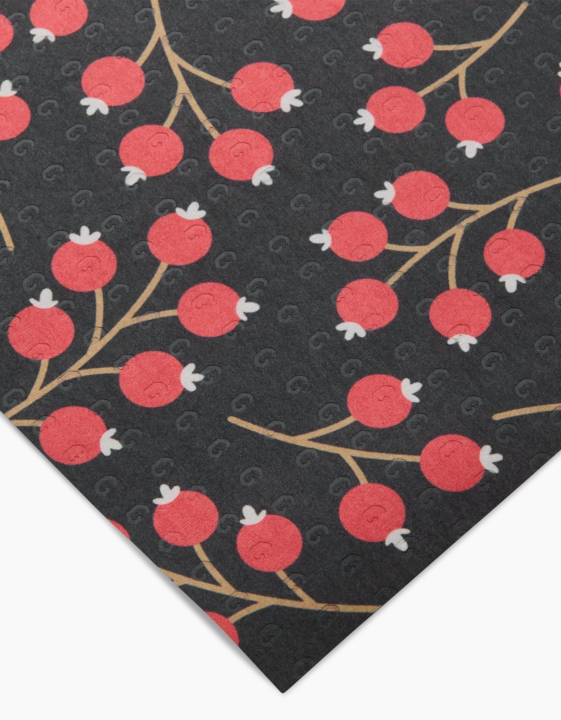 Christmas Berries by Megan Kampa features red berries and brown stems on a dark background with textured swirls. Displayed at an angle to show the repeating berry pattern, this machine-washable fabric is ideal for eco-friendly reusable paper towels.