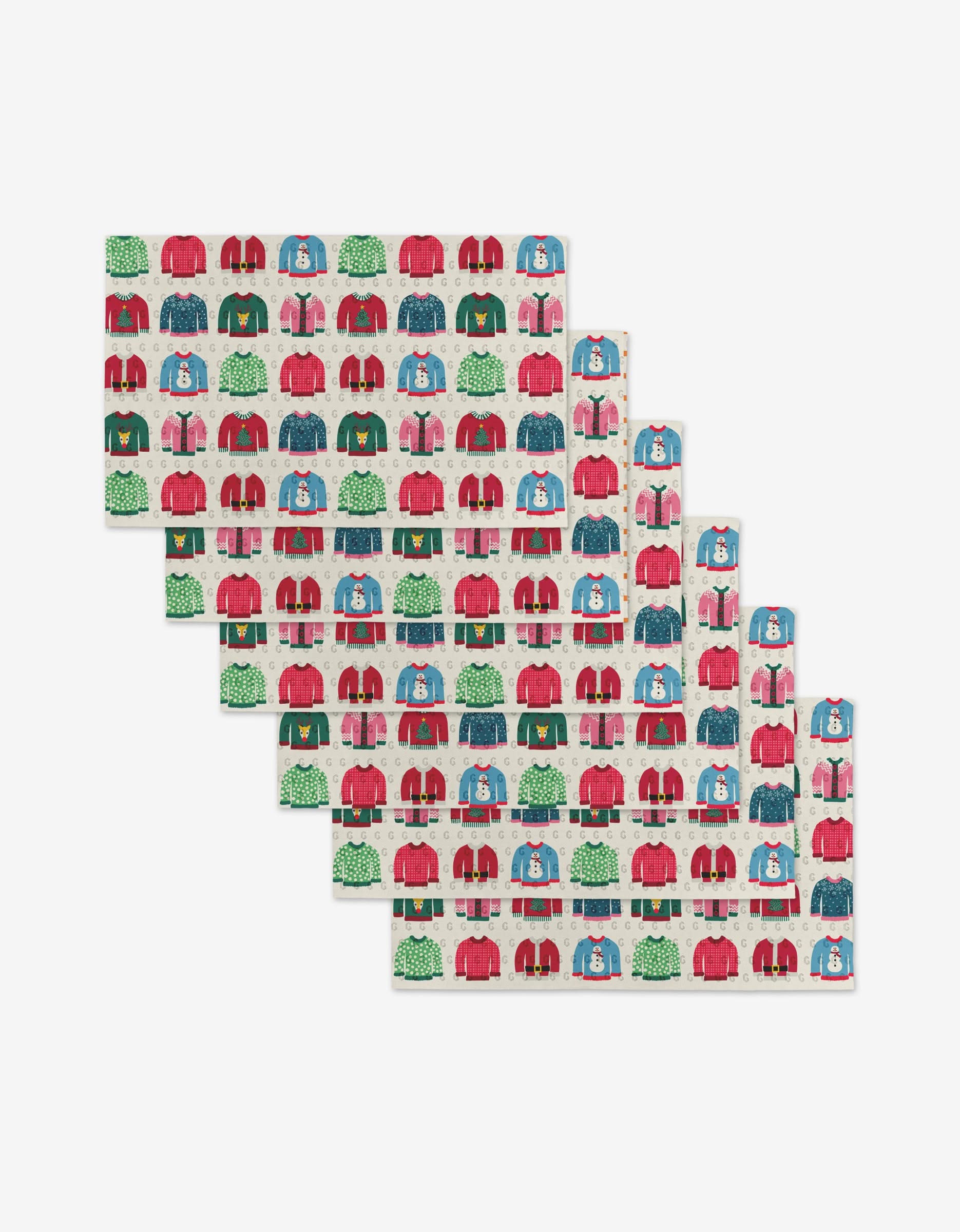 Rebecca Bobko’s Christmas Sweaters set includes five stacked rectangular trays with a festive pattern of sweaters, trees, and snowmen in red, green, blue, and white. Made from reusable post-consumer recycled materials.