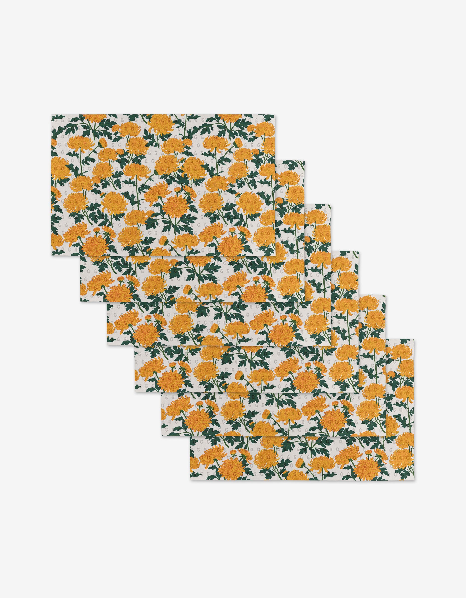 Set of six rectangular Chrysanthemum placemats by Vaishali Design Studio, featuring yellow and orange flowers with green leaves on a white background—an eco-friendly alternative to paper towels.