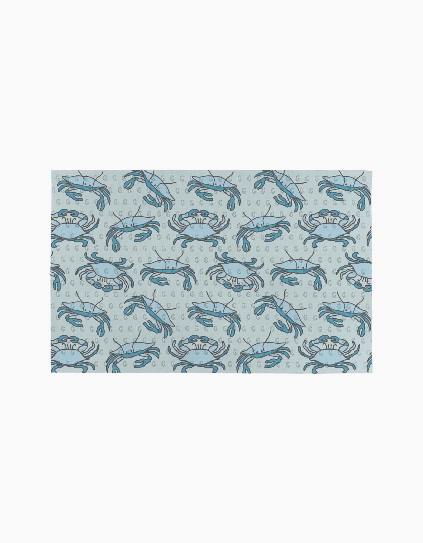 The Mindfulnice Coastal Crew mat features a repeating blue crab and bubble pattern on light gray, inspired by eco-friendly paper towels.