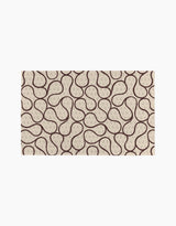 Coffee Reverie by Gerdadzy is a rectangular beige rug with a repeating abstract pattern of dark brown curves and dotted loops, creating an organic, wavy look—ideal for pairing with eco-friendly kitchen towels or recycled paper towels.