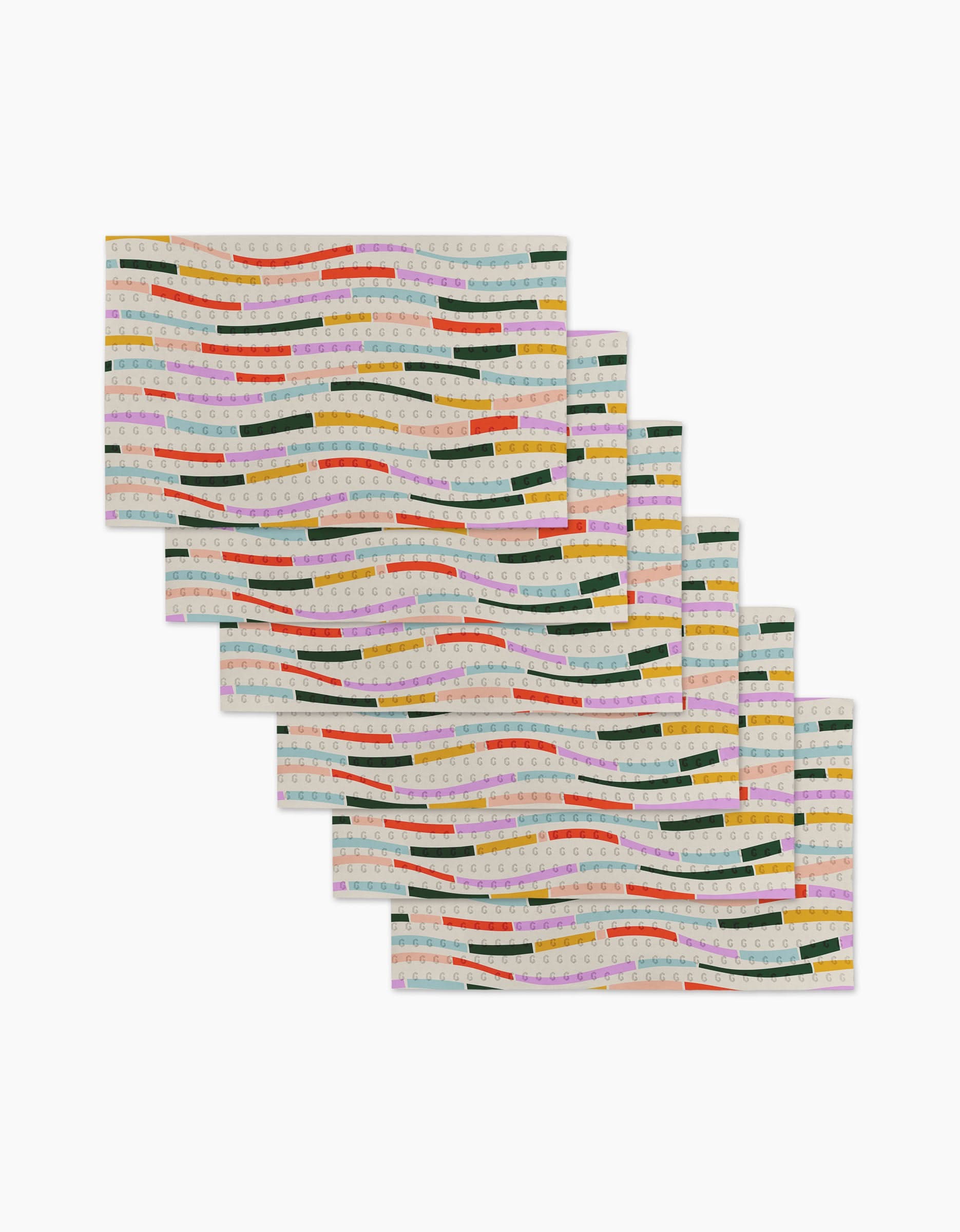 Six Colorful Currents rectangular placemats by Geometry feature wavy green, yellow, red, orange, and pink stripes on a light background—made from eco-friendly post-consumer recycled materials and arranged in a fanned-out stack.