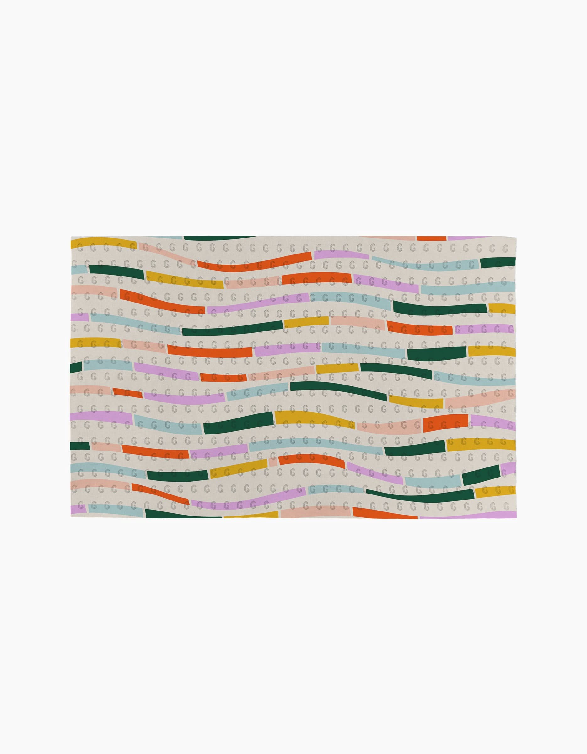 The Geometry Colorful Currents rug is rectangular and eco-friendly, made from post-consumer recycled materials. It features wavy green, yellow, orange, pink, and purple stripes with repeating “G” patterns on a beige background.