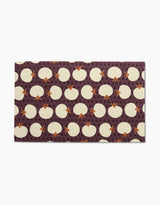 Add vibrant color to your kitchen with the Dancing Fall mat by Lizzie Clark, featuring white eggs, orange chicken feet, and small G letters on a dark purple background—perfect for pairing with reusable paper towels.