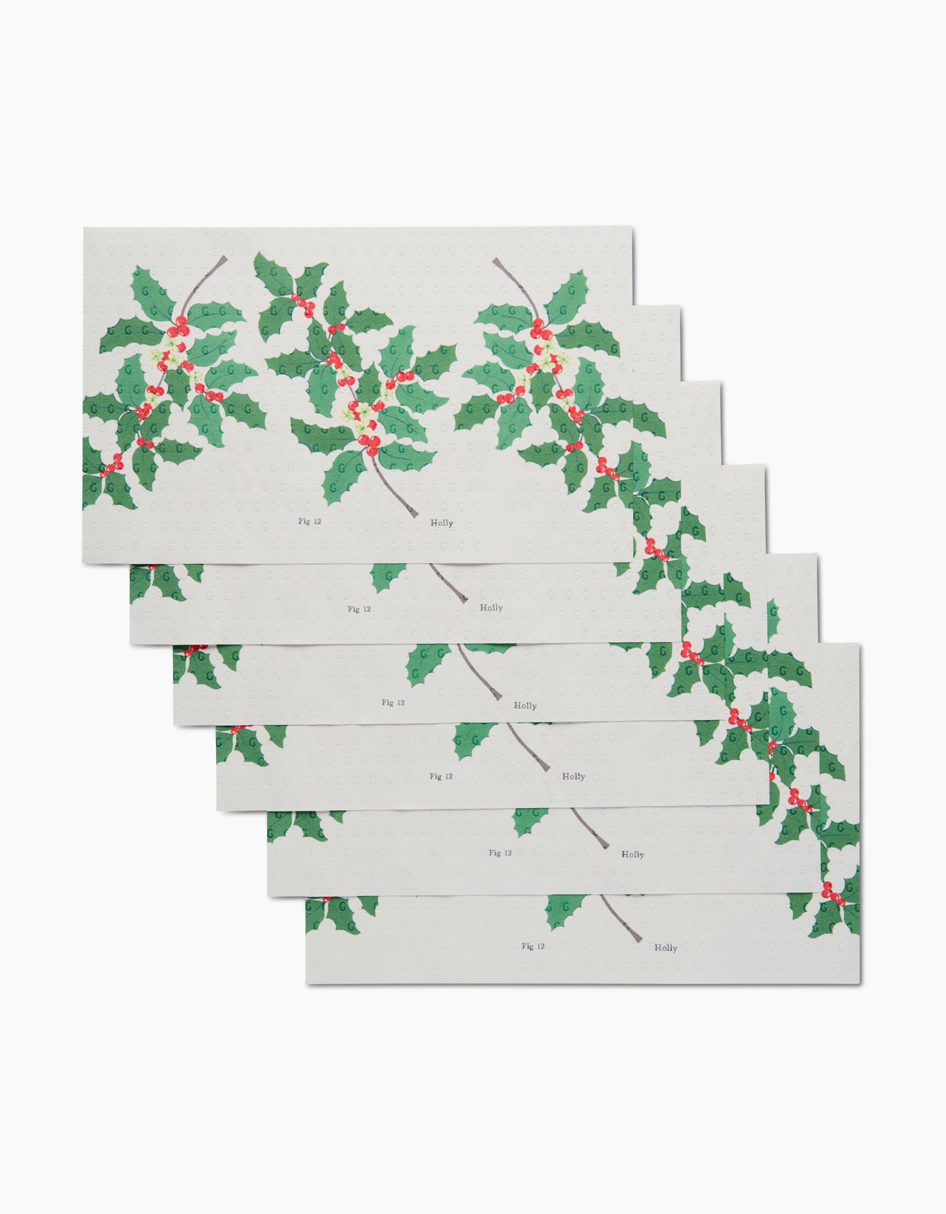 Six December Holly cards by Linda Fox, stacked and rectangular, each display holly branches with green leaves and red berries on a white background. Made from eco-friendly materials, holly is labeled near the leaves.