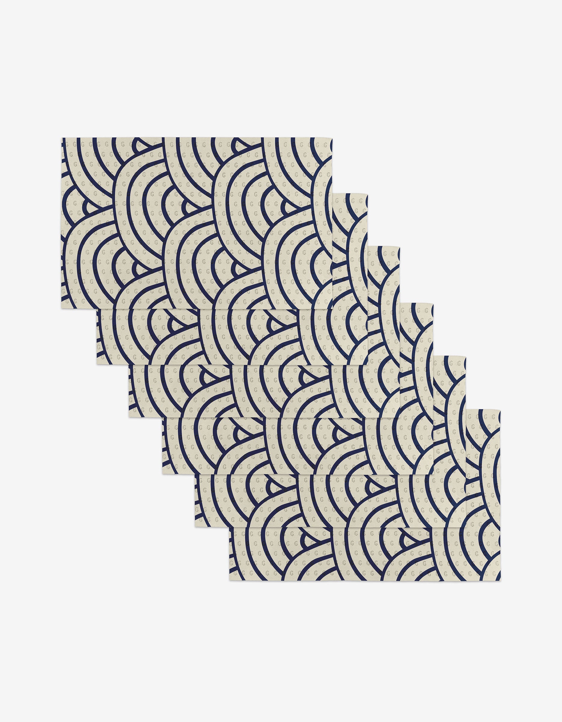 The GEOMETRY Every Level set includes six rectangular cards crafted from post-consumer recycled materials, with repeating navy blue wave patterns on a cream background, arranged in a staggered, overlapping layout on white.