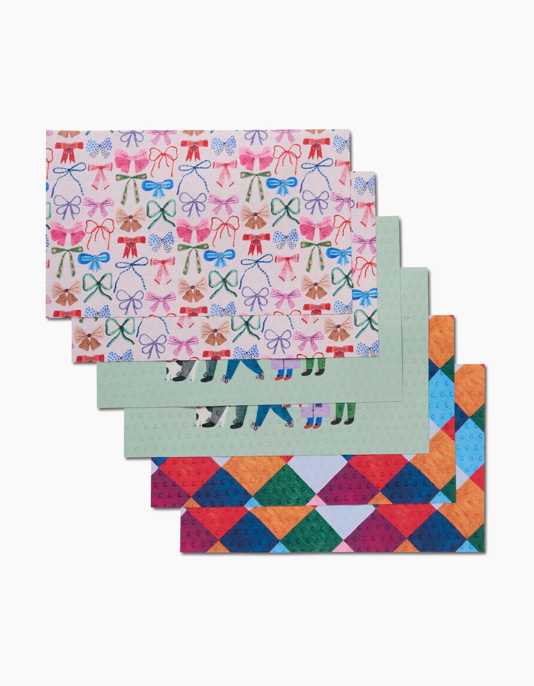 Five reusable paper towels from Daria Solak’s Family Christmas set feature festive designs—bows, bells, skates, and diamonds—and are fanned out to show all patterns. These eco-friendly towels add holiday style to any cleaning routine.