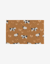 The Farm Animals mat by Coit Creative is a rectangular brown mat with cows, sheep, chickens, and horseshoe patterns on white, crafted from eco-friendly materials for sustainable style.