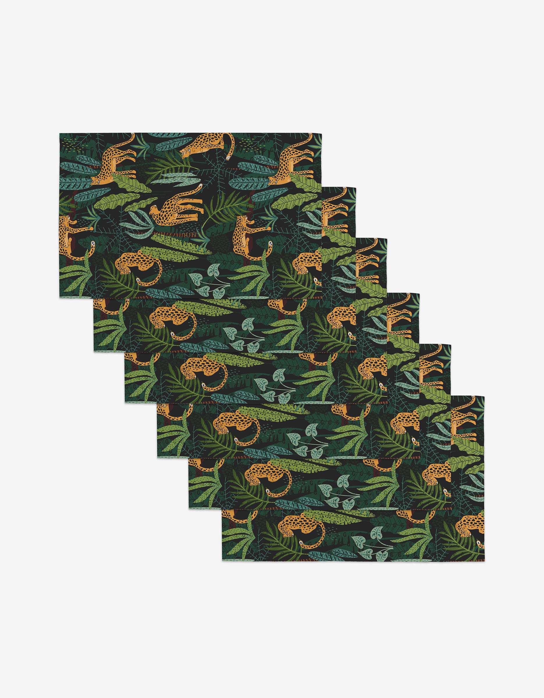 Six reusable rectangular placemats by GEOMETRY, called Feeling Spotty, feature green leaves, leopards, and lizards on a black background—an eco-friendly way to style your table. Shown fanned out.