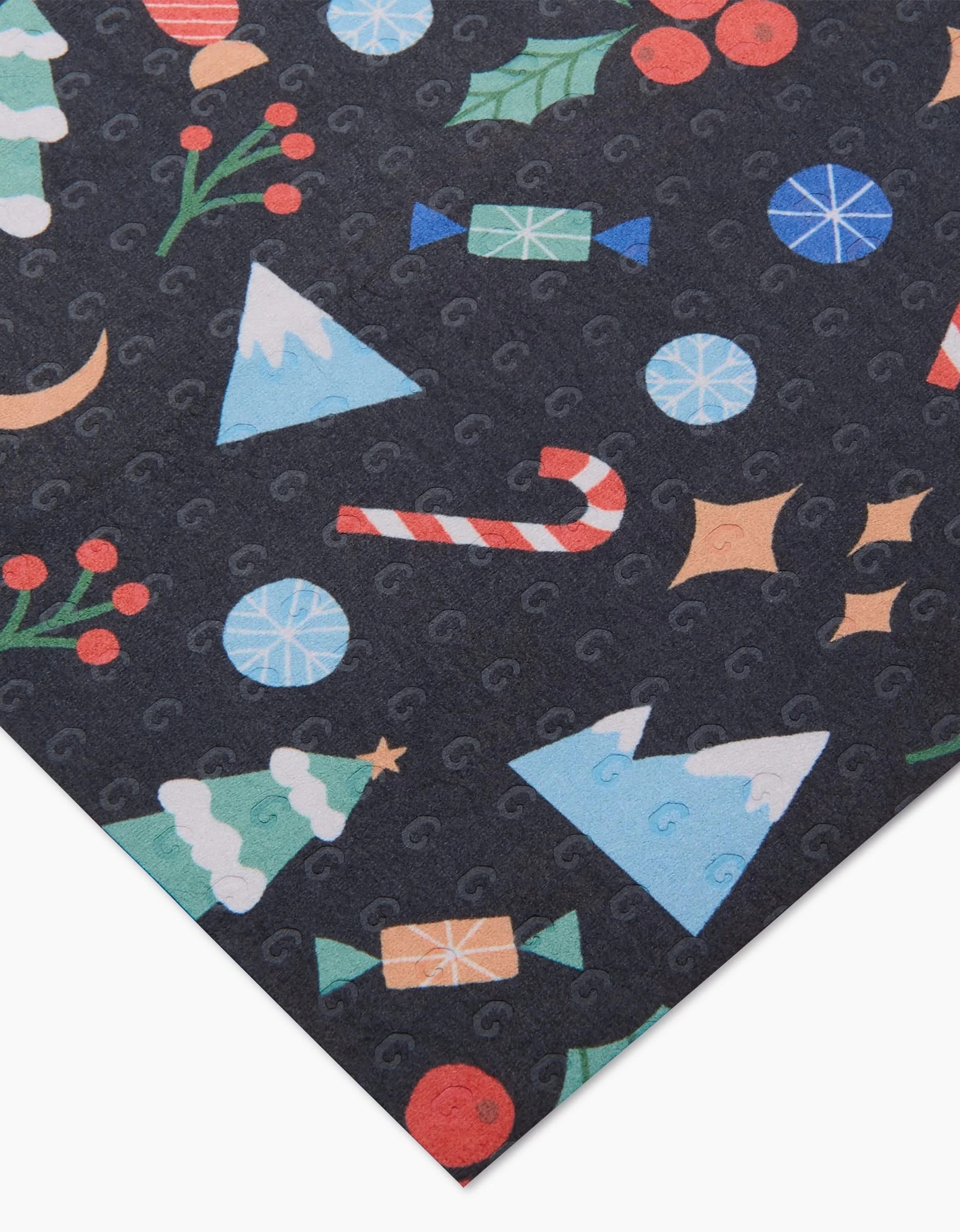 Claire Iglesias’s Festive Christmas is a dark, machine washable wrapping sheet with cheerful holiday designs—like Christmas trees and candy canes—offering an eco-friendly alternative to disposable wraps.