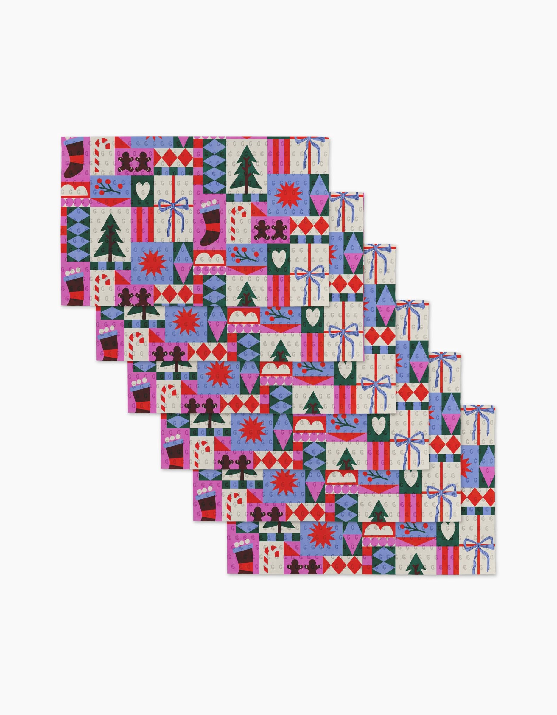 Claire Iglesias’ Festive Christmas Quilt set includes eight folded napkins with vibrant holiday patterns—trees, hearts, stars, presents, and snowflakes—in red, green, purple, blue, and pink, resembling reusable paper towels.
