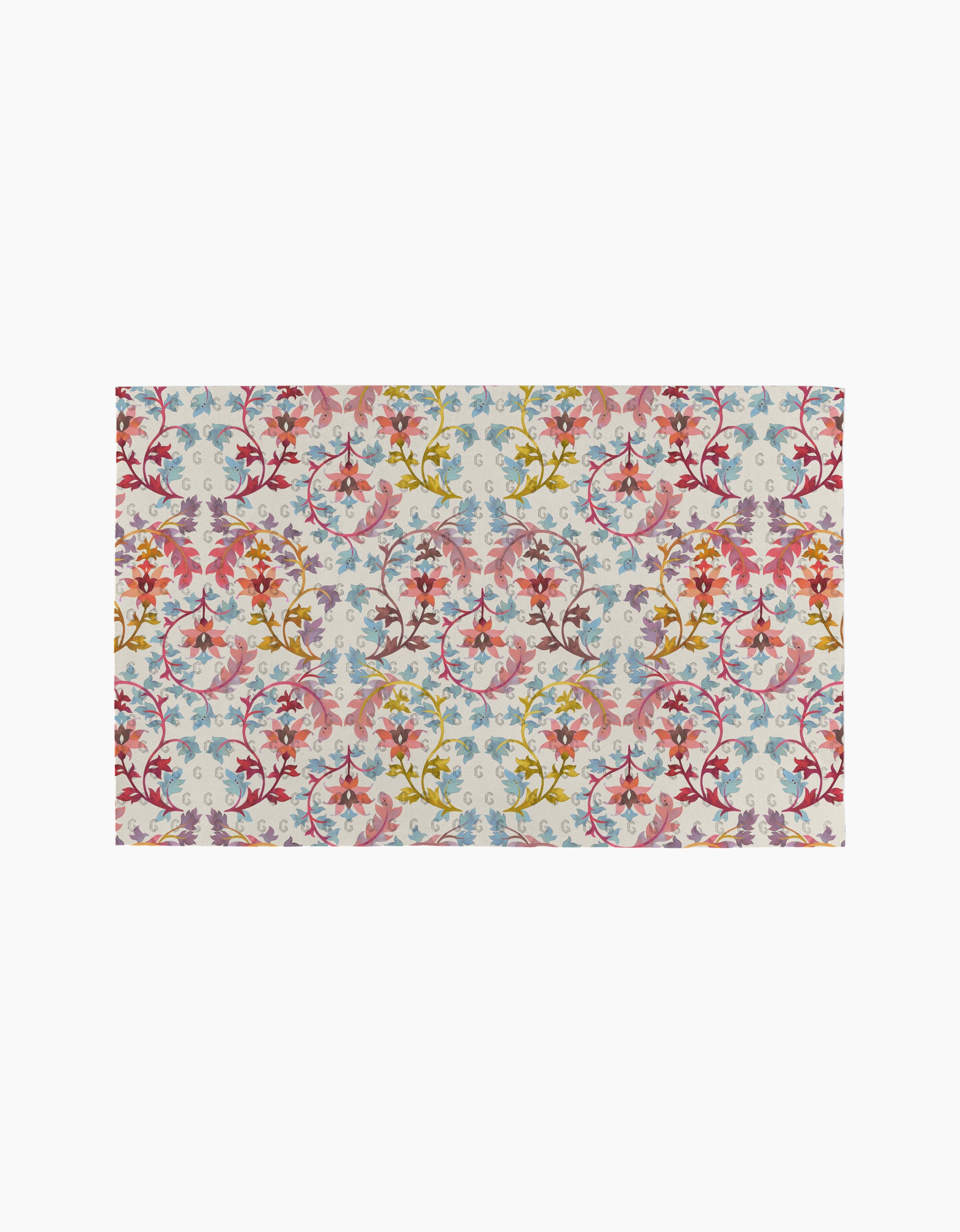 The Folk Medallion rug by Maayan Alper-Swan features a vibrant floral and vine pattern in pink, yellow, blue, and red on a light background, perfect for pairing with sustainable decor like eco-friendly paper towels.