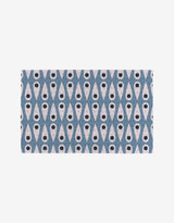 Forest Findings by Anette Heiberg features a repeating geometric pattern of blue X-shapes with white tear-drop centers and black dots on a light background—an eco-friendly alternative to Not Paper Towels.