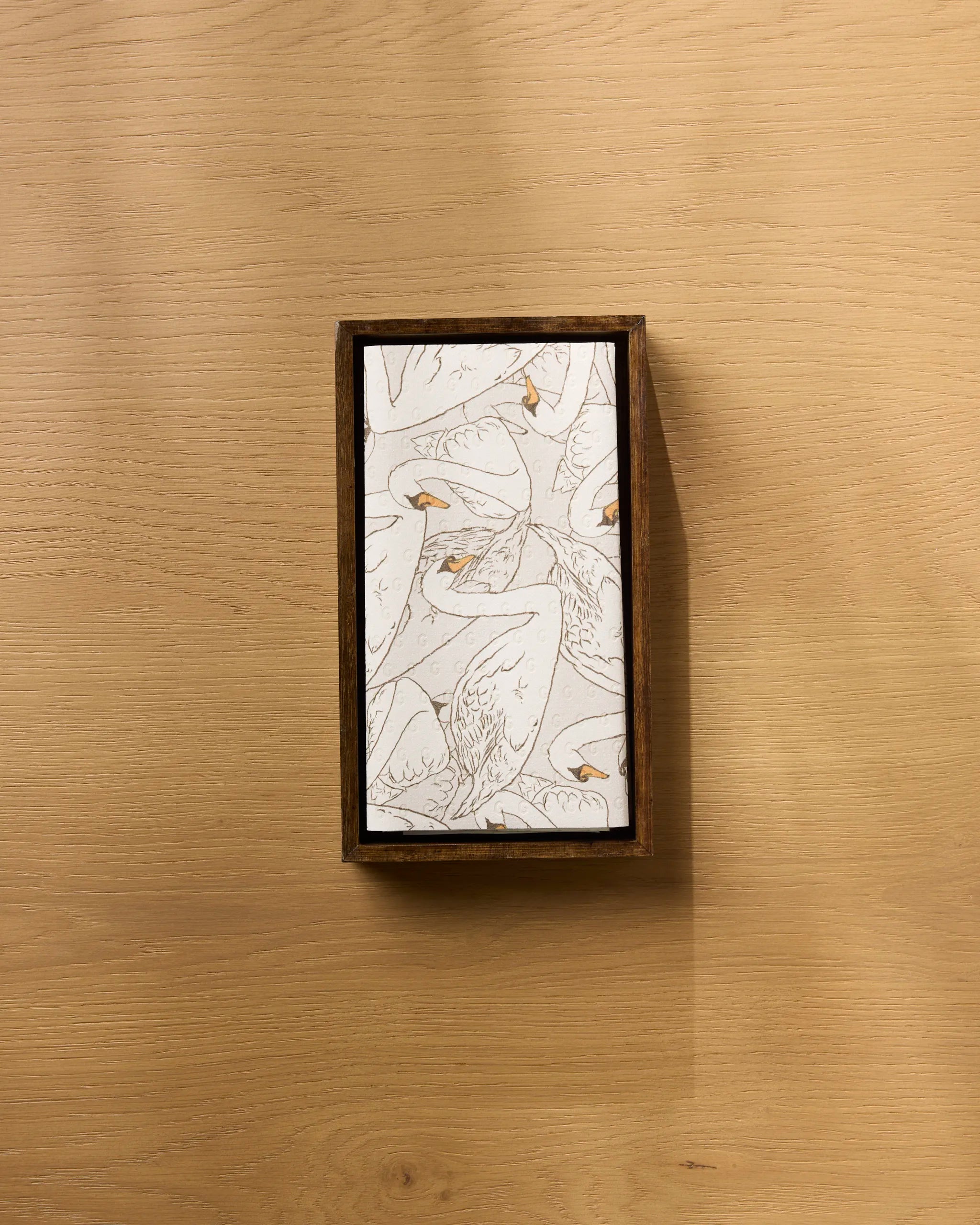 The Gentle Strength rectangular wooden tray by Geometry features illustrated swans on a white surface—perfect for serving breakfast and pairing with your favorite eco-friendly paper towels.