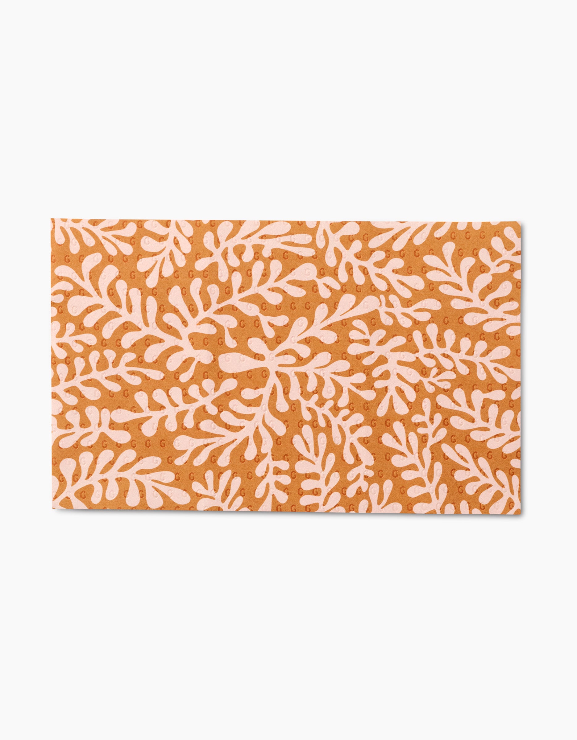 Golden Fall by GEOMETRY is a rectangular tile with a terracotta orange background and repeating white stylized leafy branches. Its bold, organic, botanical pattern is crafted from eco-friendly materials.