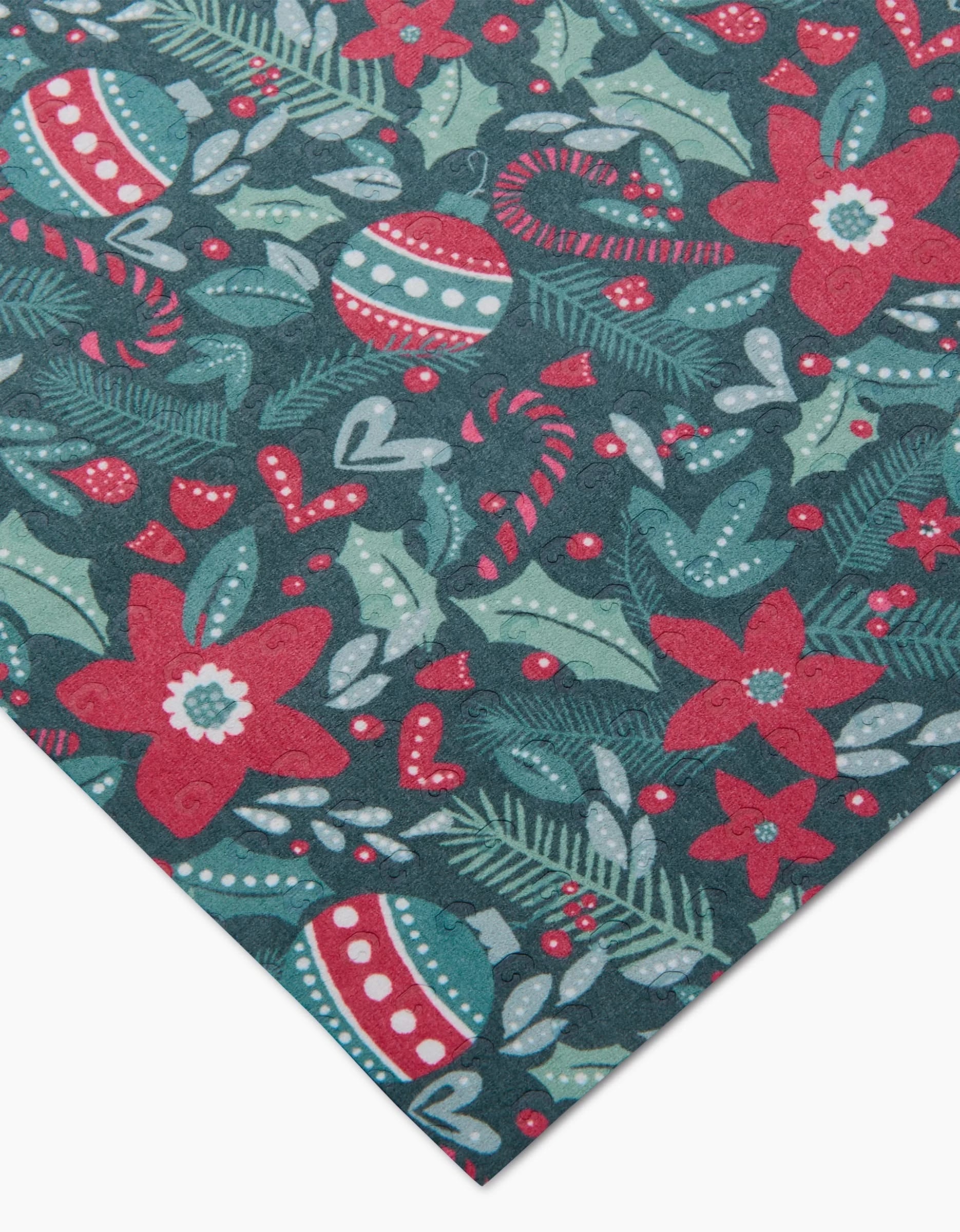 Happy Christmas by Kris Ruff is a festive patterned fabric with red poinsettias, candy canes, ornaments, holly, and pine on dark green—an eco-friendly option thats perfect for reusable paper towels and is machine washable for easy care.
