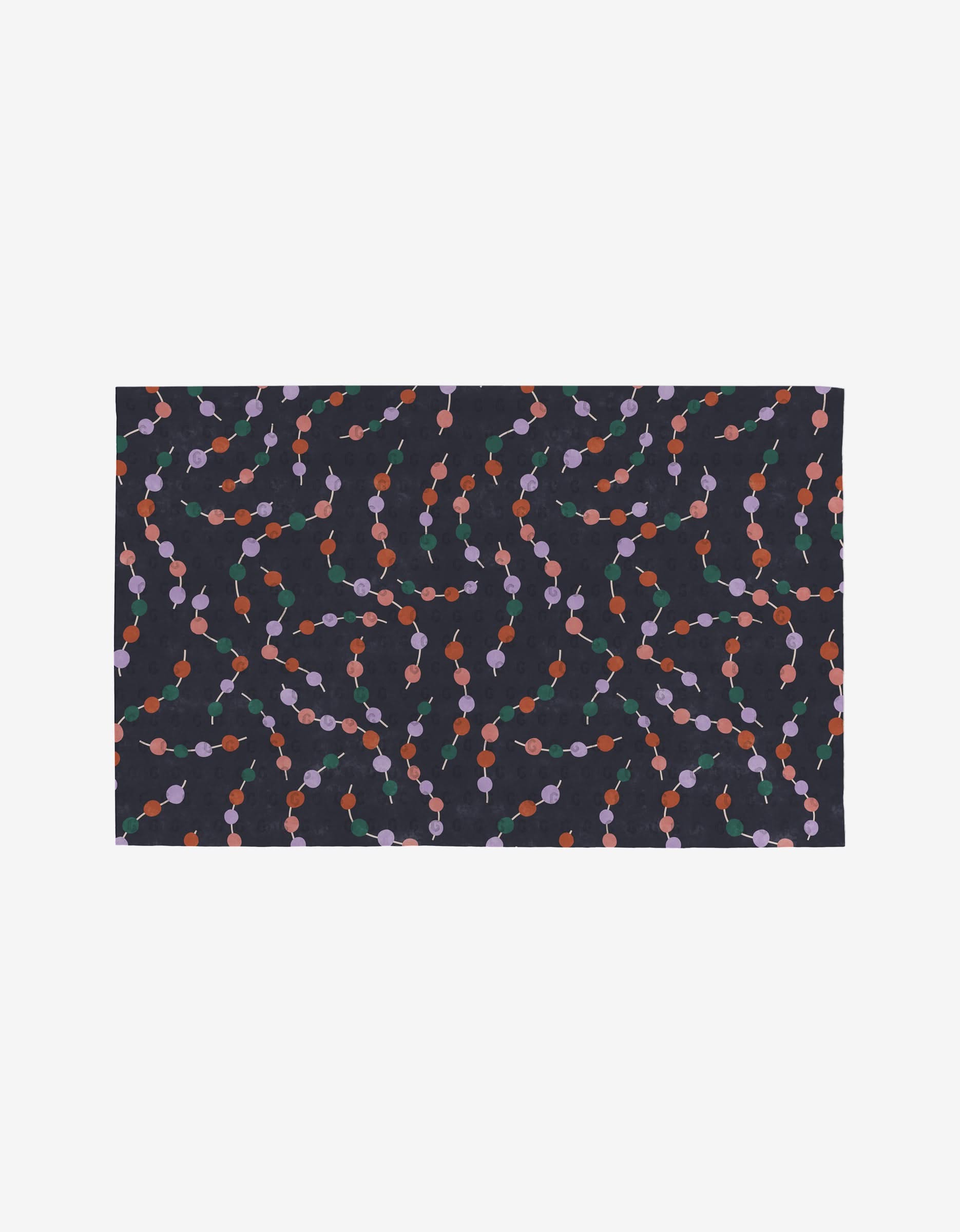 Happy Holly by Claire Iglesias is a rectangular fabric with a dark base, featuring wavy orange, red, and purple dots joined by green lines. Made from post-consumer recycled materials, its an eco-friendly alternative to paper towels.