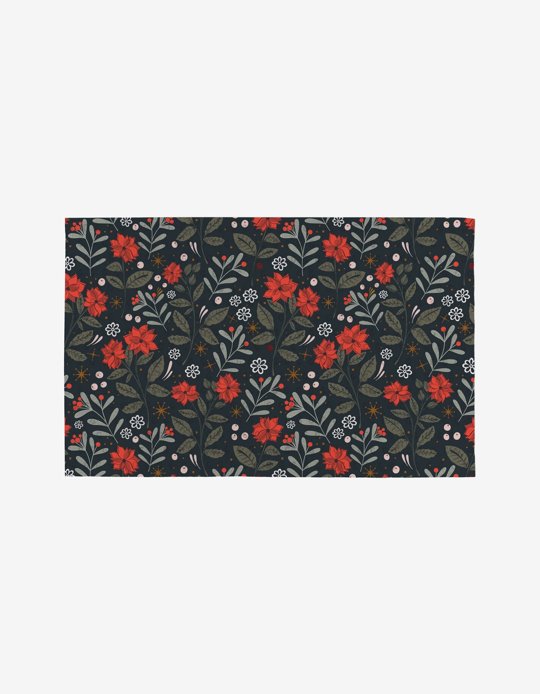 The Holiday Floral rug by Charlie Rowan Designs features a dark backdrop with a reusable floral pattern in red, orange, and white flowers, green leaves, and sprigs arranged in a repeating design.