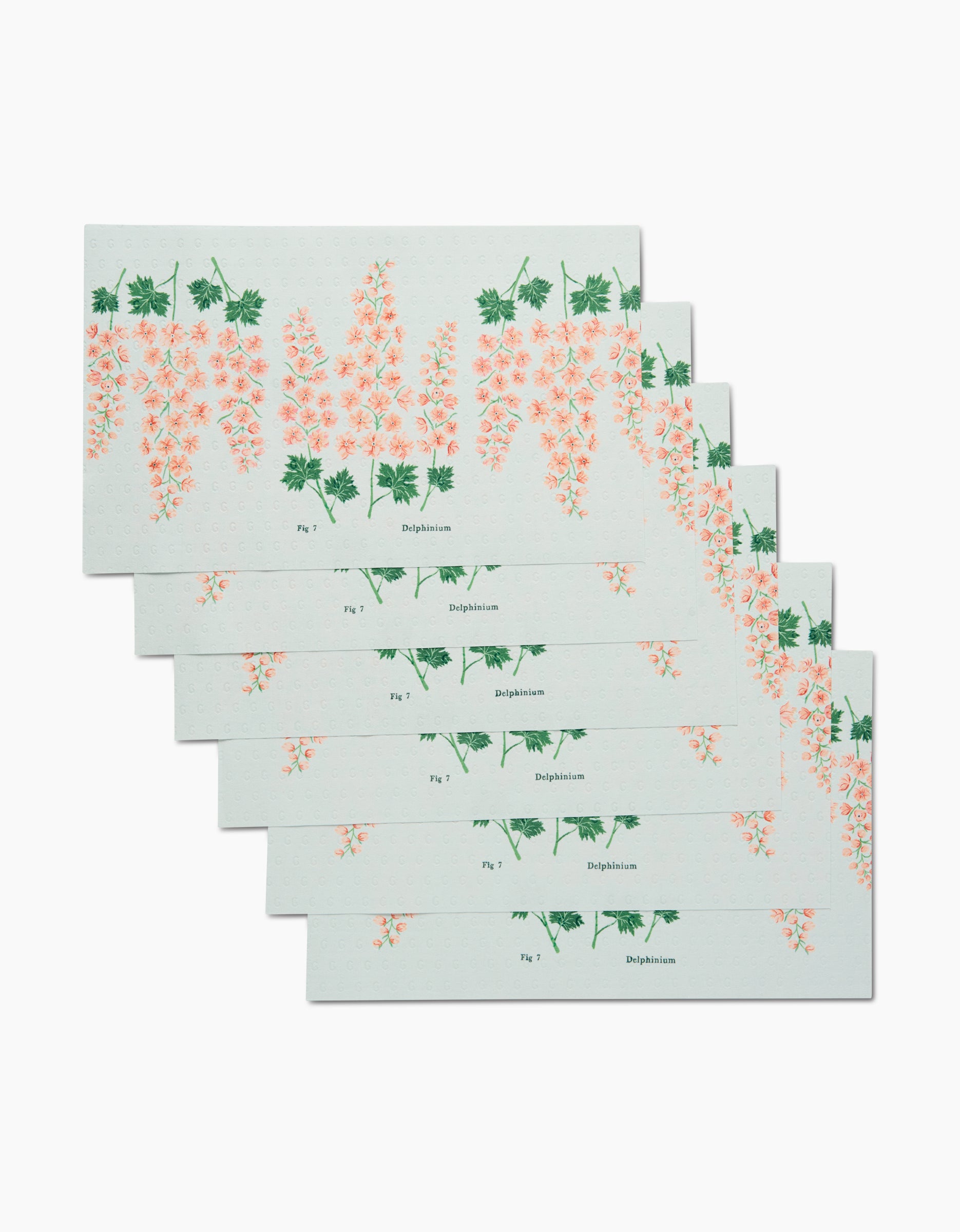 Six rectangular July Delphinium cards by Linda Fox are arranged in a stepped stack, each made from eco-friendly materials and featuring a botanical illustration of pink Delphinium flowers with green leaves and labeled “Delphinium.”.