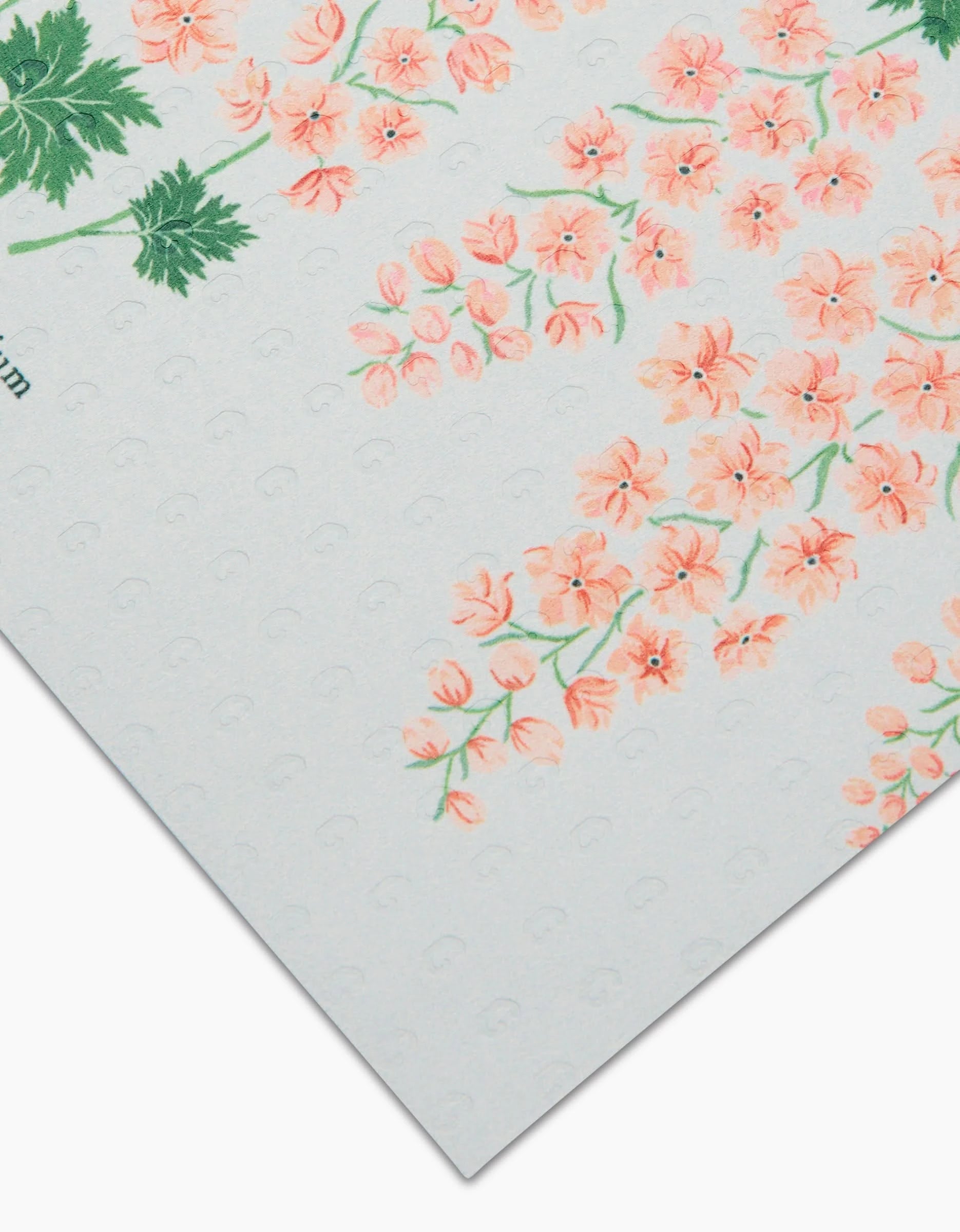 A close-up of July Delphinium by Linda Fox: textured white Not Paper Towels featuring clusters of small pink flowers and green leaves, printed on eco-friendly, post-consumer recycled materials.