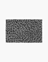 Leaf Swirls by Rachel Parker features a black rectangle filled with dynamic, white, leaf-like shapes that evoke the texture of reusable paper towels and create movement and depth against the dark background.