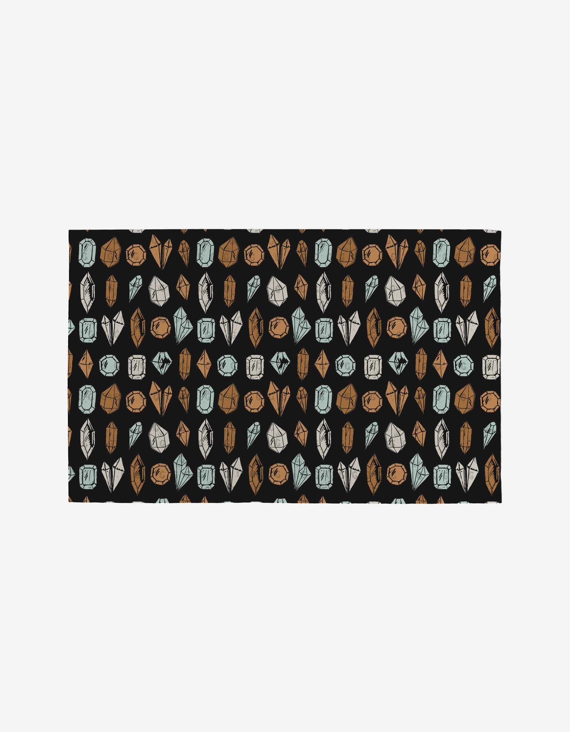 Love Potions by Hufton Studio is a rectangular fabric with illustrated crystals and gemstones in brown, gray, and blue on black. Made from post-consumer recycled materials, its an eco-friendly, reusable alternative for your projects.
