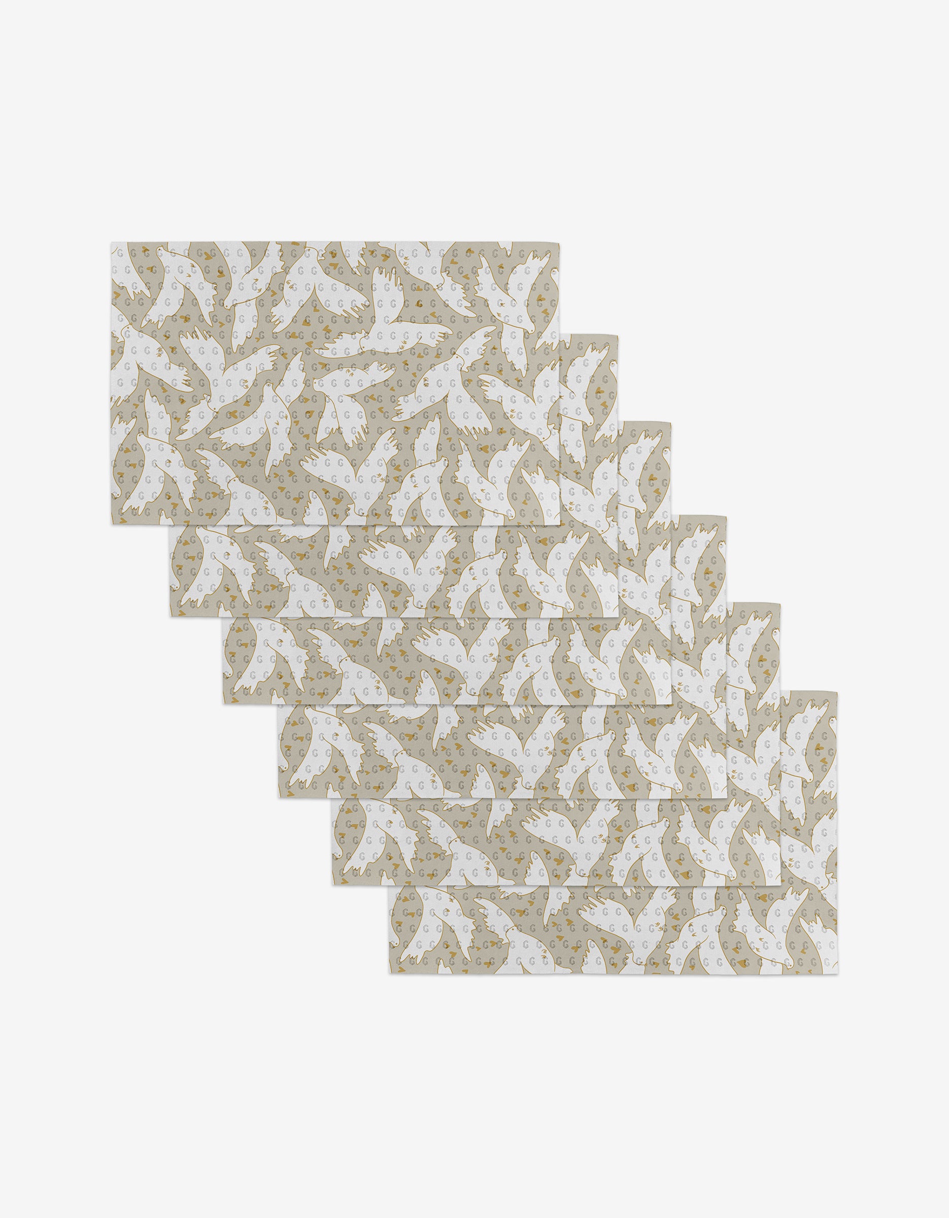 Set of ten Love Takes Flight reusable kitchen towels by GEOMETRY, featuring a staggered arrangement of white birds and gold stars on a beige background.