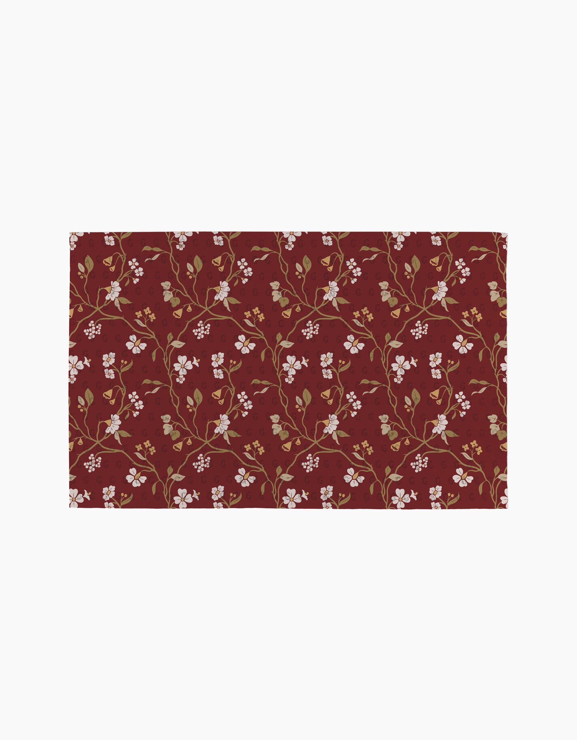 Danelys Sidron's Lunaria in Merlot rug has a maroon base with a symmetrical floral pattern in cream, gold, and brown—an elegant touch for eco-conscious homes that use reusable paper towels.