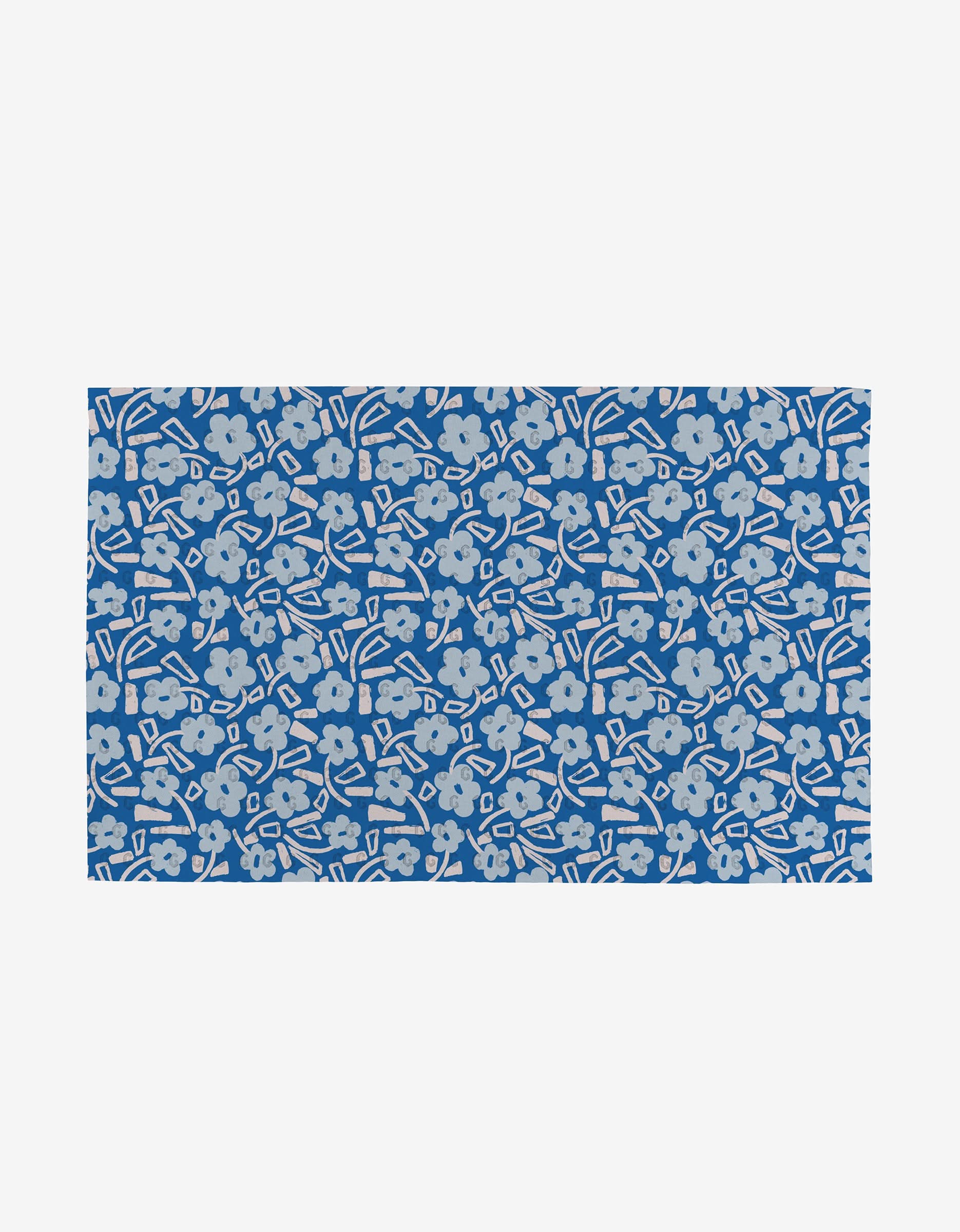 The Happy Hemera Magic Field is a rectangular blue mat featuring light gray flowers and abstract shapes on white—an eco-friendly choice made from post-consumer recycled materials.