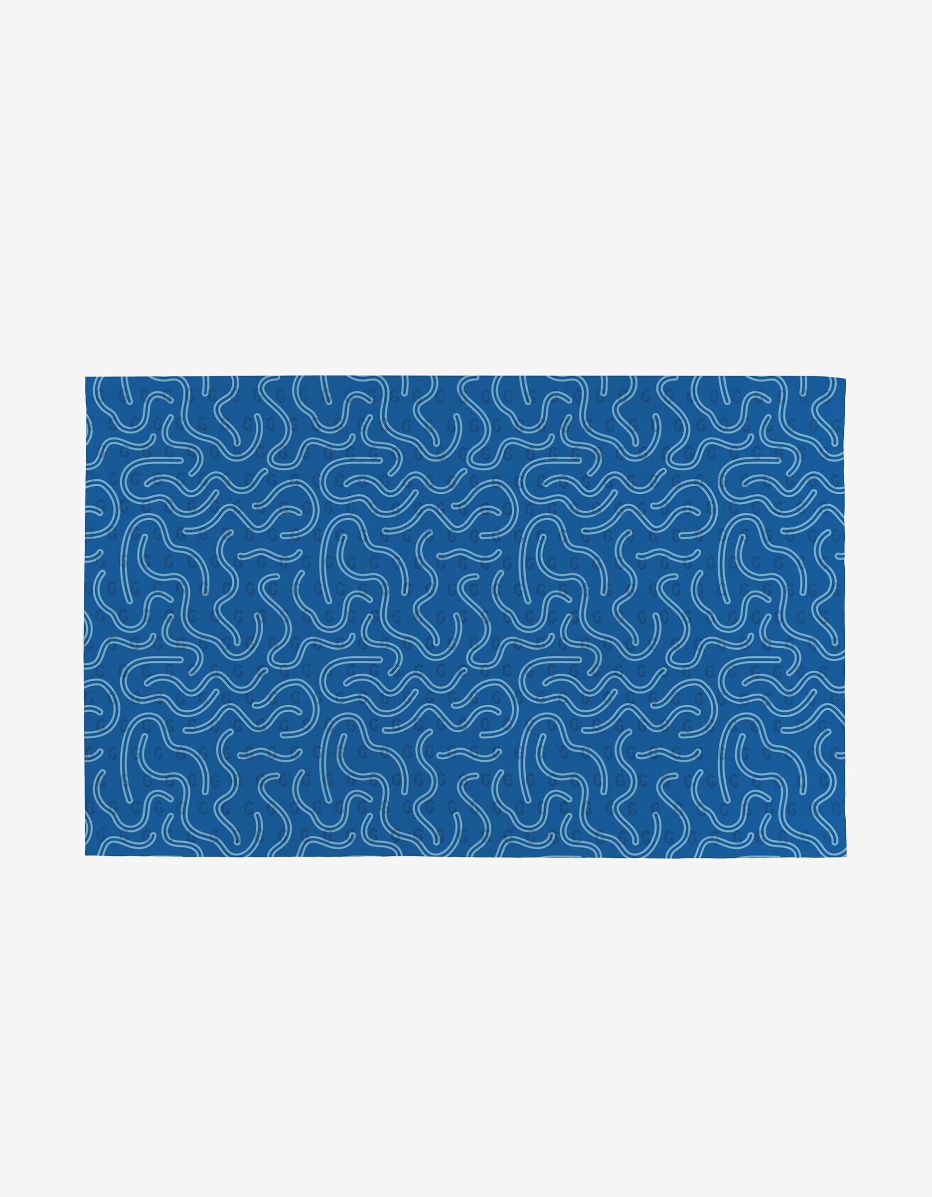The Magic Field by Happy Hemera is a rectangular blue rug with evenly scattered wavy white lines, made from post-consumer recycled materials and shown on a plain white background.
