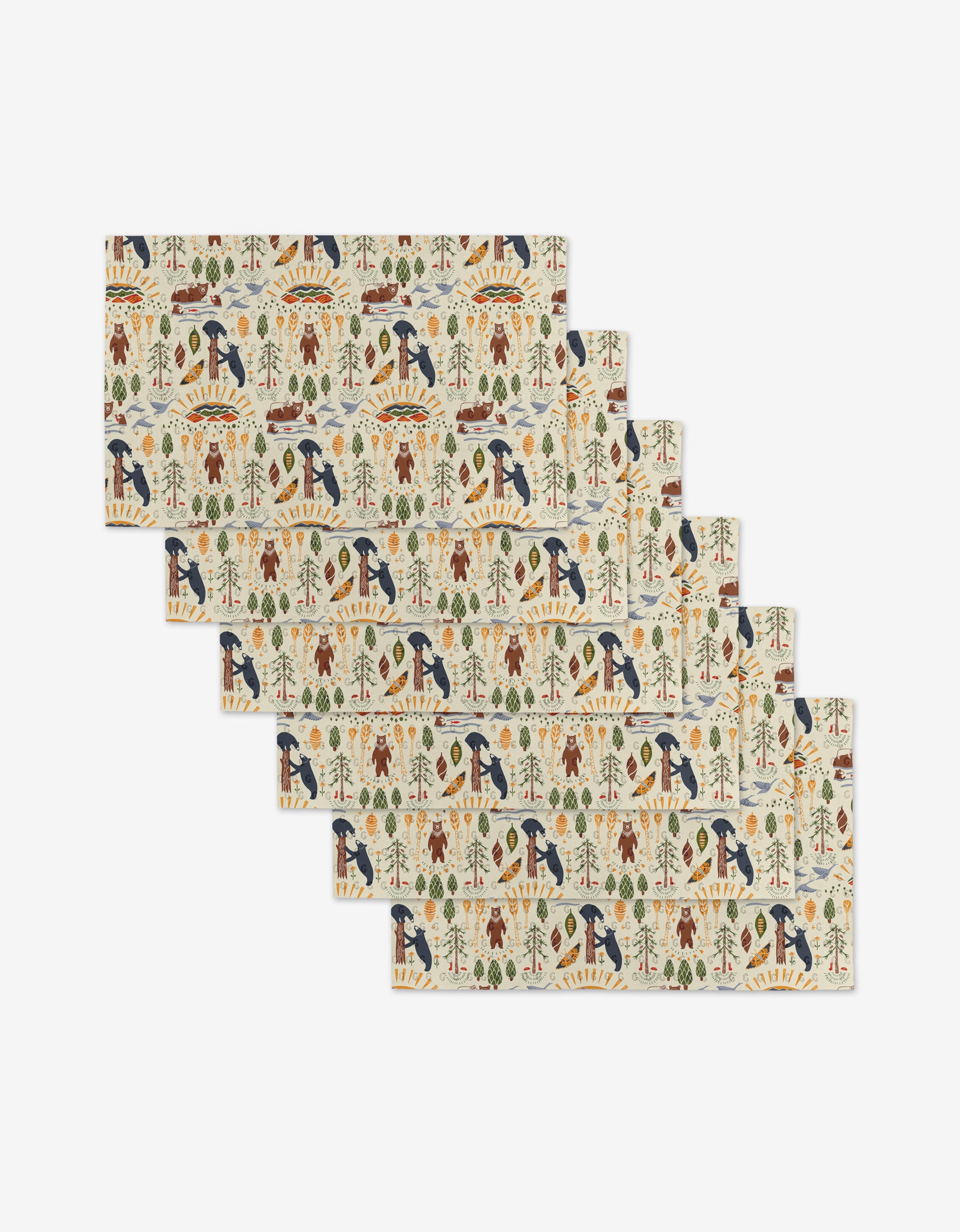 The Mama Bear placemats by Elisabeth Wing are a set of six rectangular mats, each with colorful nature patterns—birds, trees, leaves, and animals on a light background—crafted from environmentally friendly materials.
