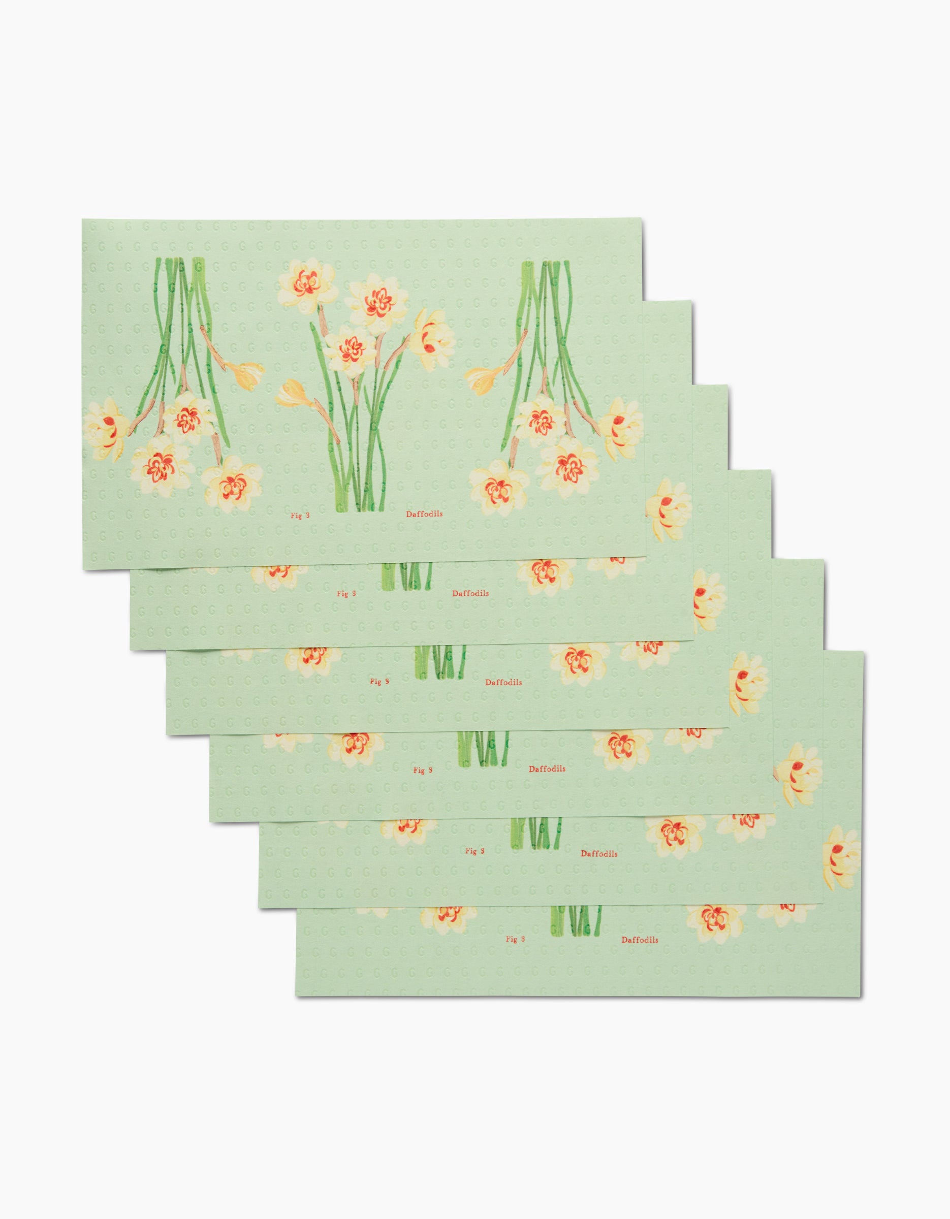 Six rectangular mint green envelopes from Linda Fox, called March Daffodils, featuring an orange floral design and dotted pattern—an eco-friendly choice for stylish correspondence.