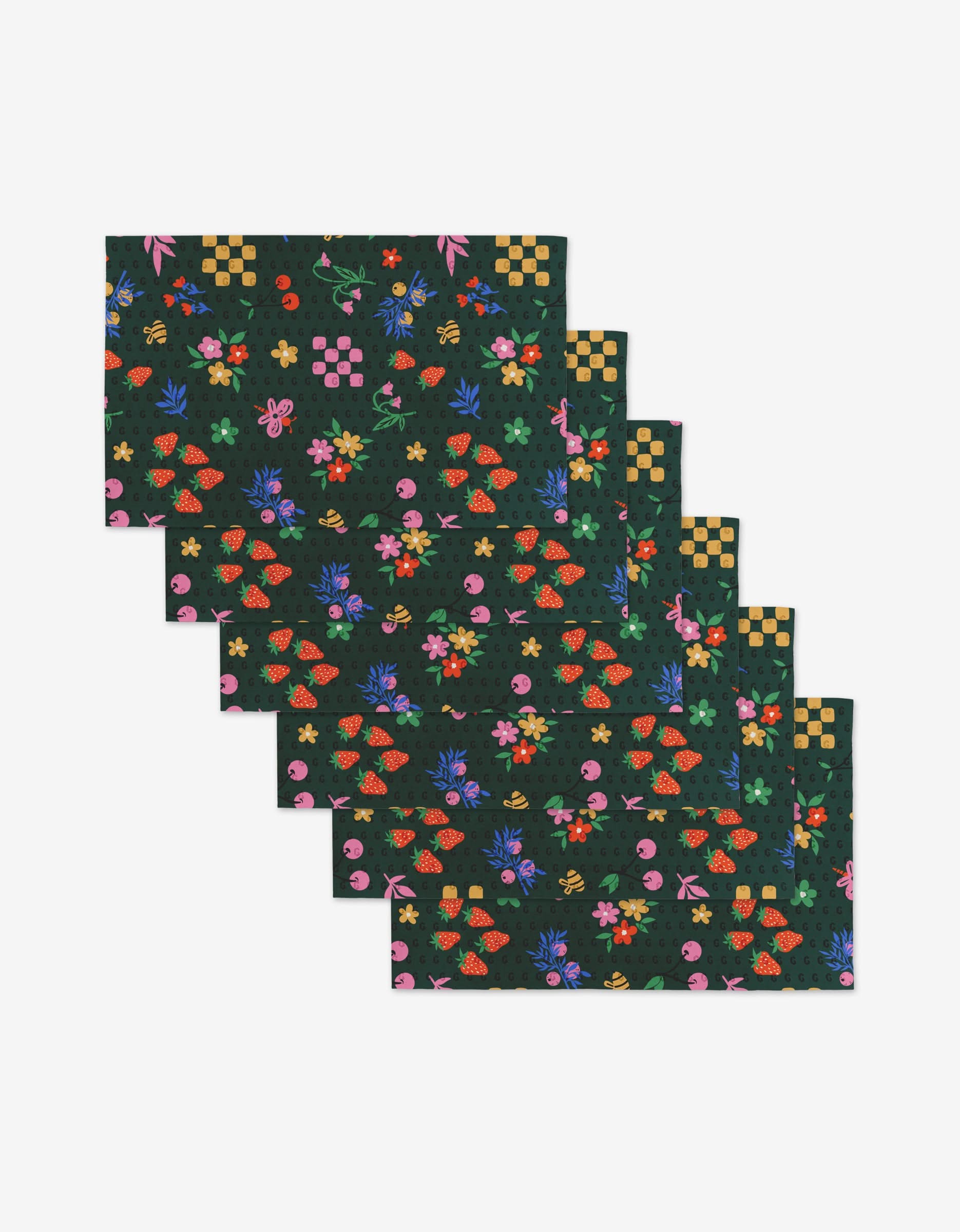 Six North Meadow Bright Night rectangular placemats by Charlie Rowan Designs feature a dark base with vibrant red, green, yellow, blue, and pink floral and geometric patterns. Made from post-consumer recycled materials, they’re shown in a staggered layout.