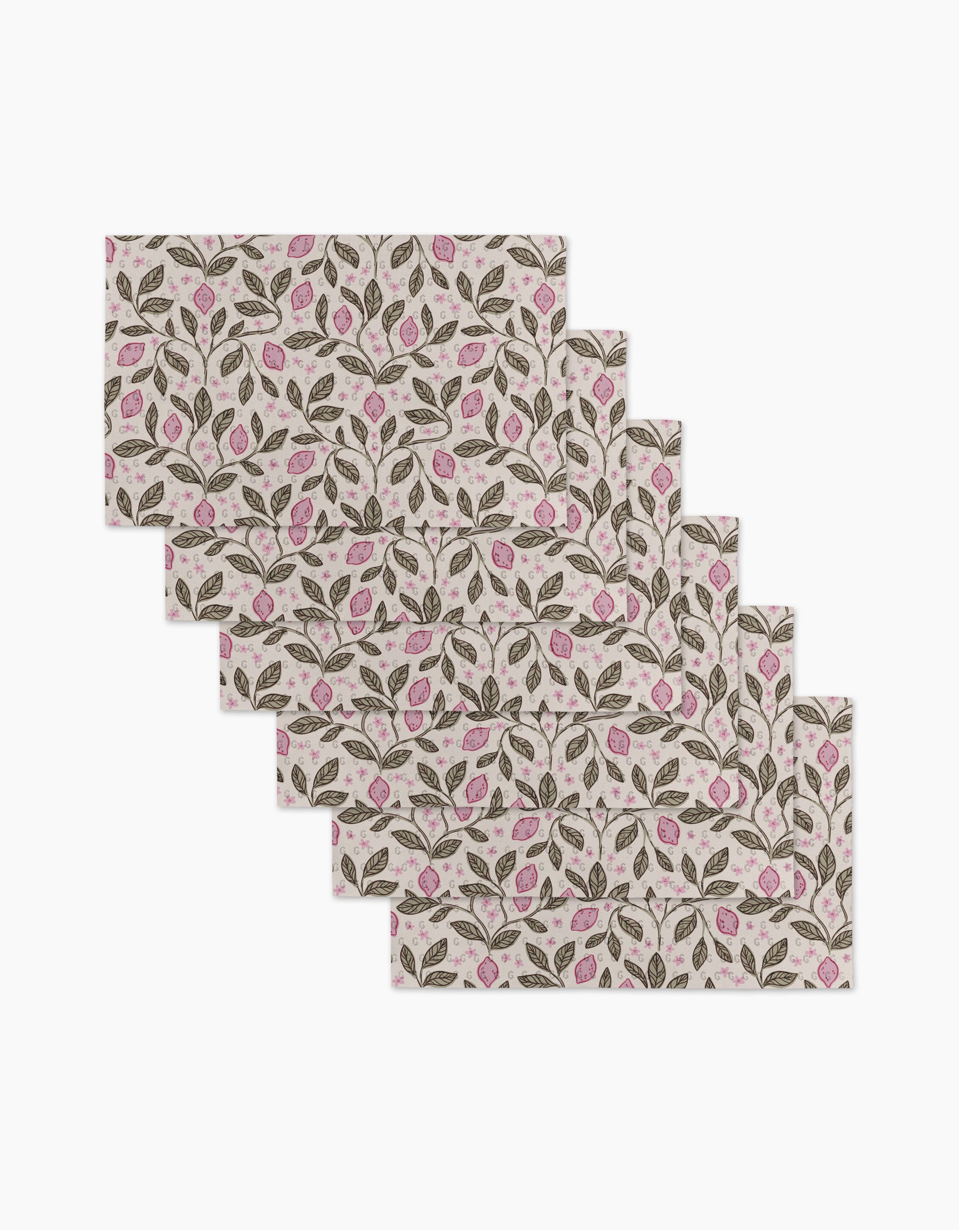 Six rectangular placemats—Pink Summer Lemons by Teri the Butter—feature a repeating pattern of green leaves and pink flowers on a light background, made from eco-friendly kitchen towels for sustainable dining.