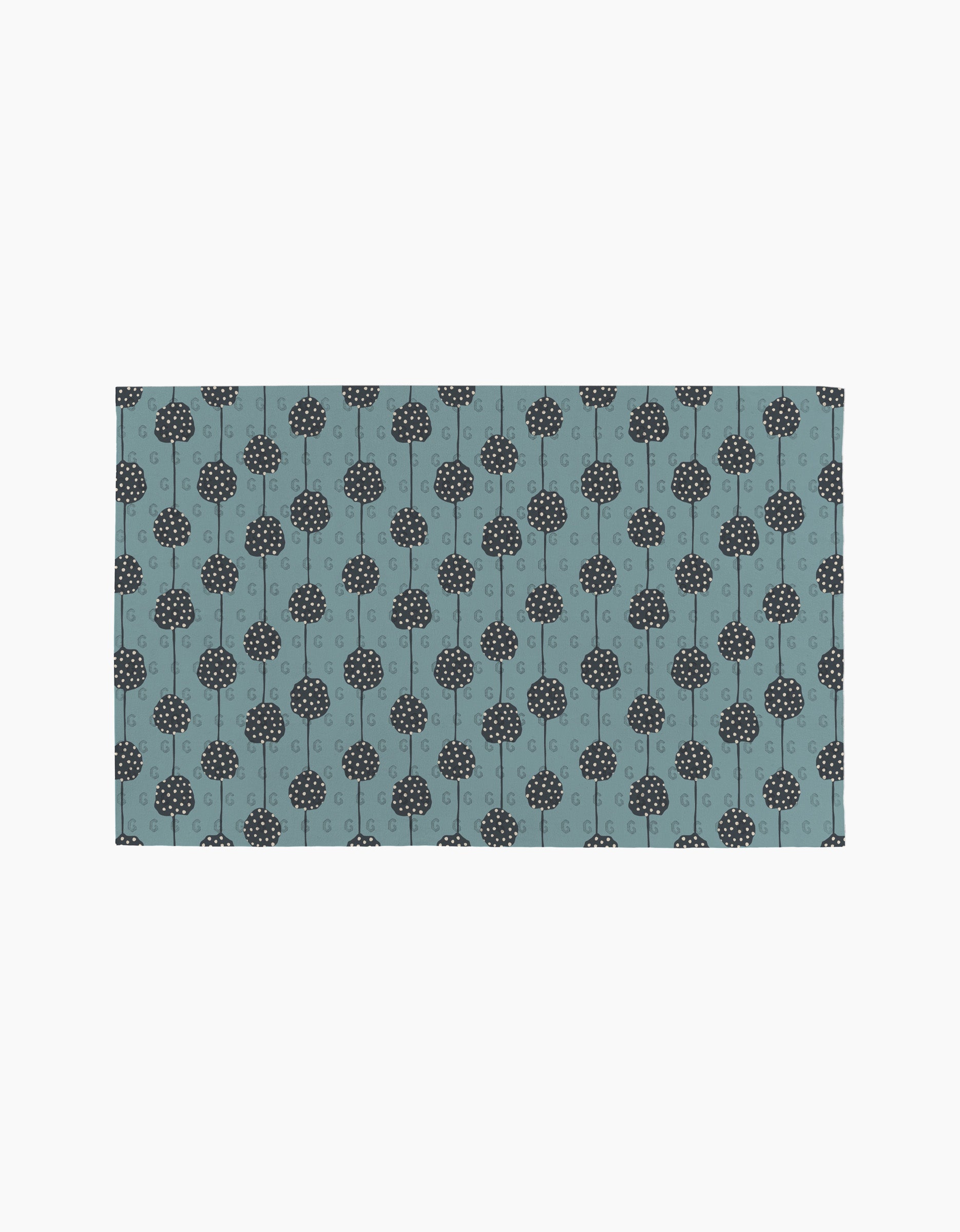 Polka Dot Blooms by Lizzie Clark is a rectangular mat featuring evenly spaced, simple black stylized trees on a muted blue background. This minimalist design brings eco-friendly, sustainable style to any space.