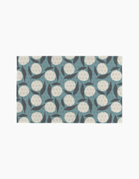 Polka Dot Blooms by Lizzie Clark features a repeating geometric pattern of cream circles with small dots and blue, dark gray crescents on a light background—ideal for pairing with eco-friendly or reusable paper towels.