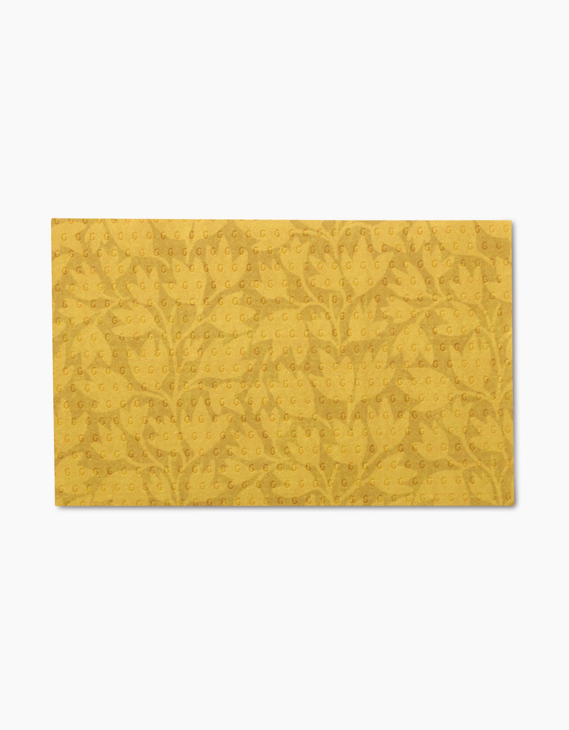 Sidney by Amy MacCready: a yellow rectangular fabric with an embossed leaf and dot pattern, crafted from eco-friendly recycled materials, shown on a white background.