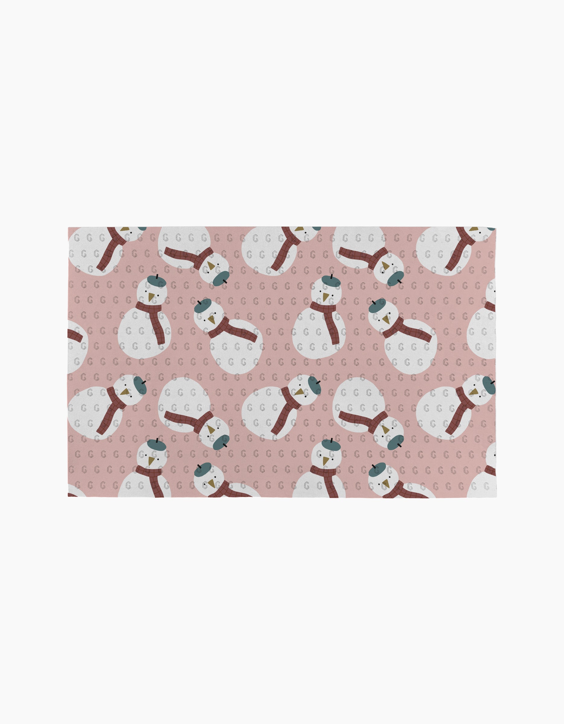 The "Snowman" mat by Jennifer Bouron features pink background with snowmen in red scarves, green hats, and scattered “G” letters—perfect to pair with reusable paper towels.