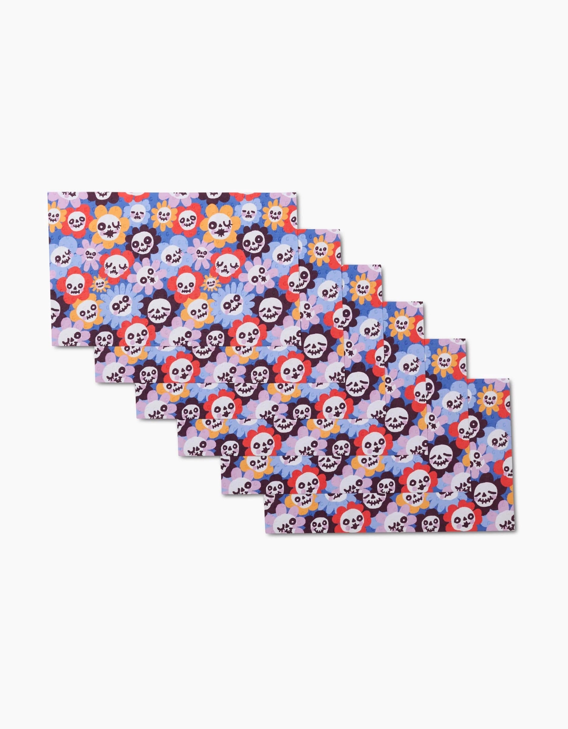 Brighten your table with So Lazo’s Spooky Bouquet—six rectangular placemats featuring cartoon skulls, flowers, and hearts in vibrant colors on light purple. Pair with eco-friendly towels for a fun, sustainable setting.
