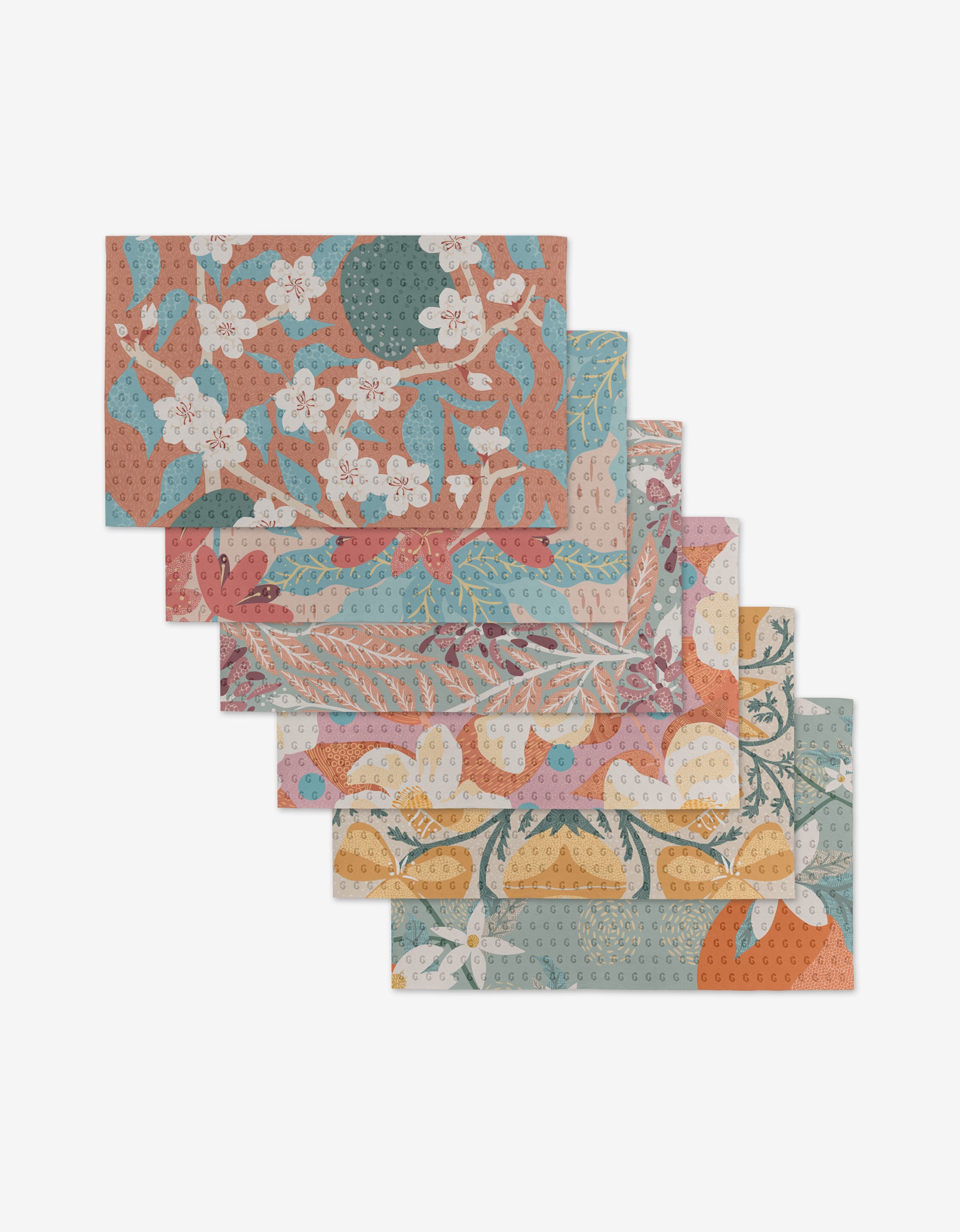Six rectangular, reusable State Flowers cloth napkins by Julianne Haness, featuring colorful floral and botanical designs in orange, blue, pink, and green—an eco-friendly alternative to paper towels.