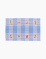 Summer Picnic Dreams by Letters By Shells is a rectangular pastel mat with a blue and beige checkered pattern, featuring small carrot, tulip, strawberry, dog bone, and fish illustrations—ideal for your eco-friendly or reusable Not Paper Towels.